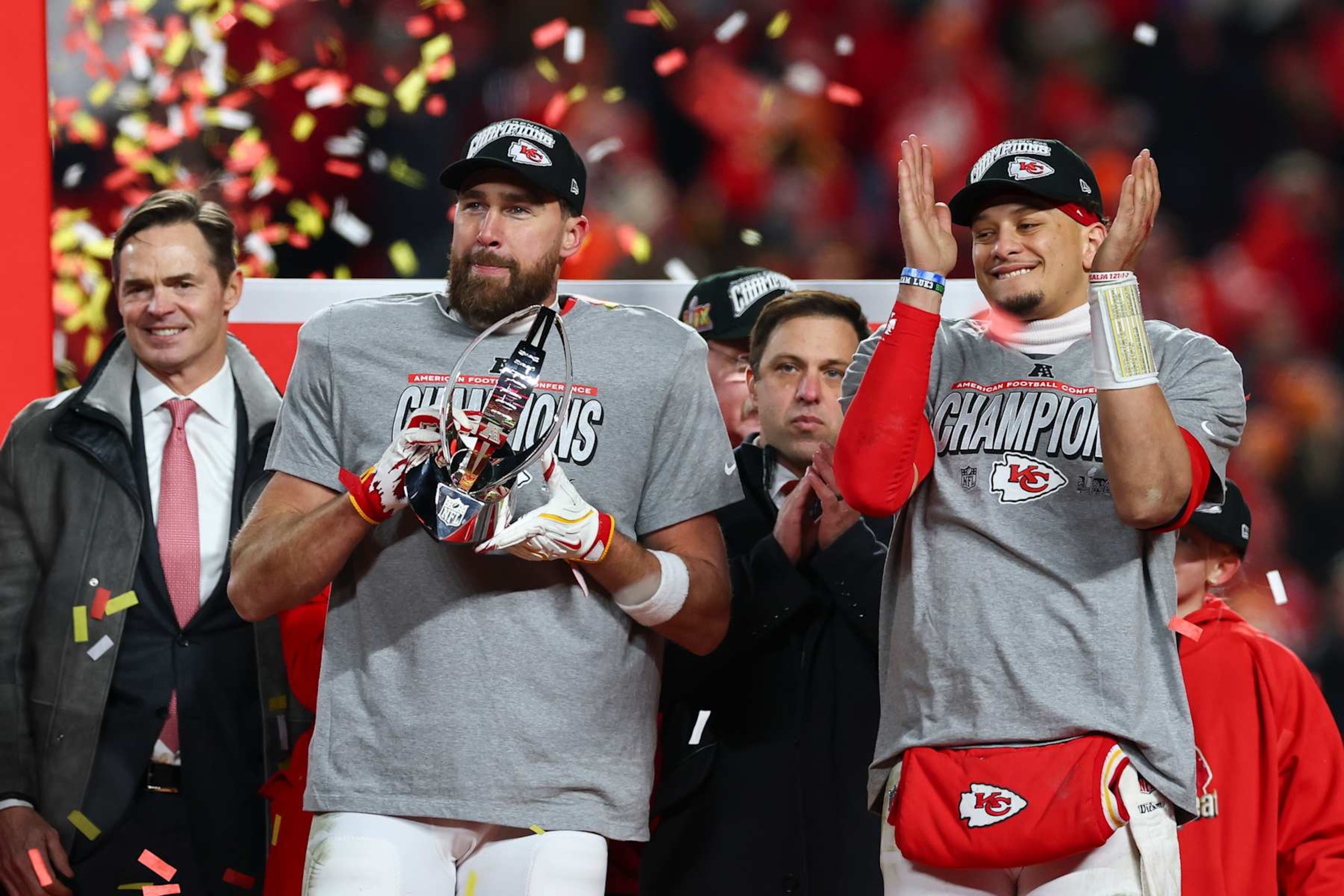 KANSAS CITY, MISSOURI - JANUARY 26: Patrick Mahomes #15 of the Kansas City Chiefs and Travis Kelce #87 celebrate on the podium following the AFC Championship Game against the Buffalo Bills at GEHA Field at Arrowhead Stadium on January 26, 2025 in Kansas City, Missouri. (Photo by Aaron M. Sprecher/Getty Images)