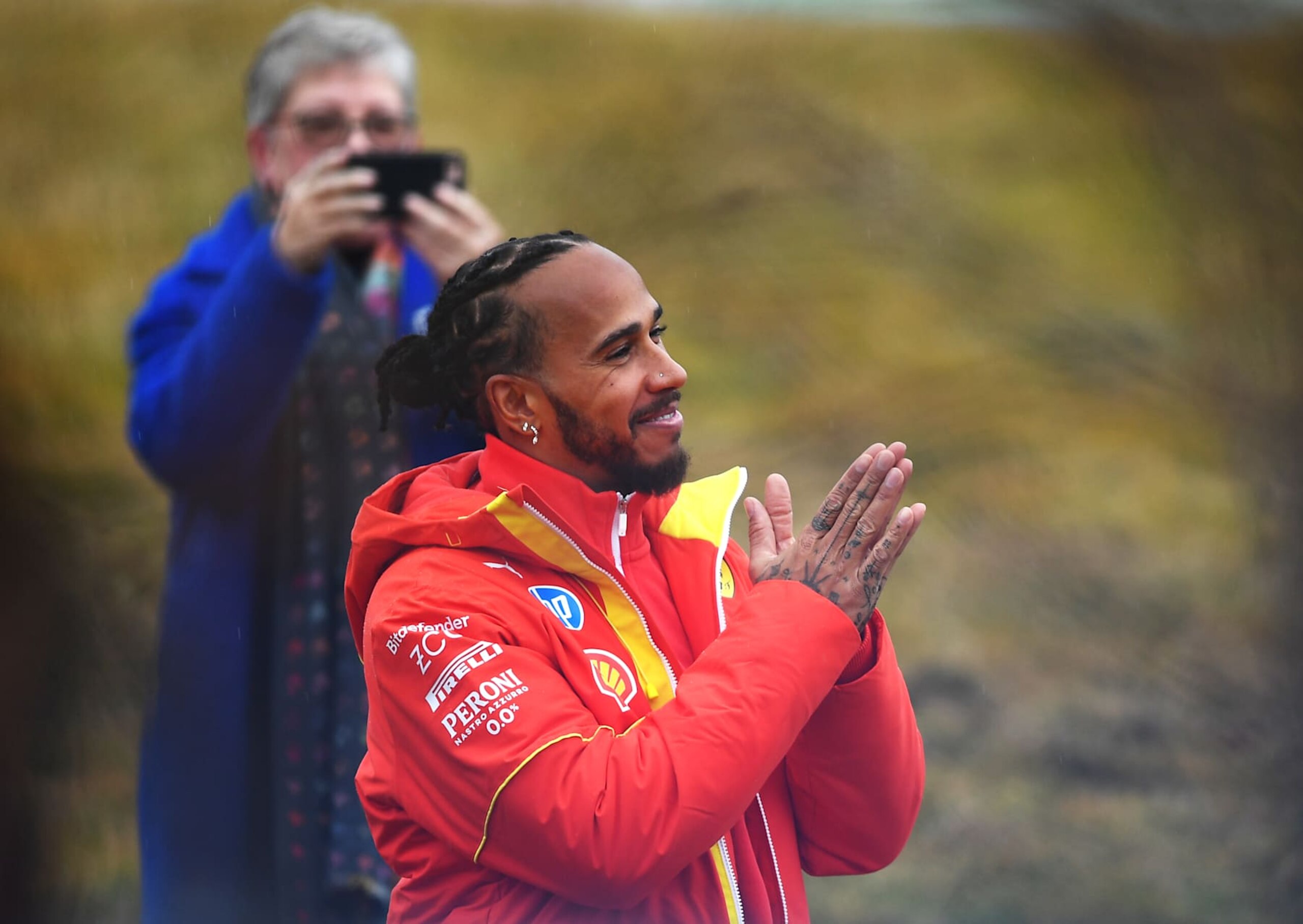 FIORANO MODENESE, ITALY - JANUARY 22: Lewis Hamilton of Great Britain and Ferrari greets the crowd during his first official days as a Scuderia Ferrari F1 driver at Fiorano Circuit on January 22, 2025 in Fiorano Modenese, Italy. (Photo by Rudy Carezzevoli/Getty Images) FIORANO MODENESE, ITALY - JANUARY 22: Lewis Hamilton of Great Britain and Ferrari greets the crowd during his first official days as a Scuderia Ferrari F1 driver at Fiorano Circuit on January 22, 2025 in Fiorano Modenese, Italy. (Photo by Rudy Carezzevoli/Getty Images)