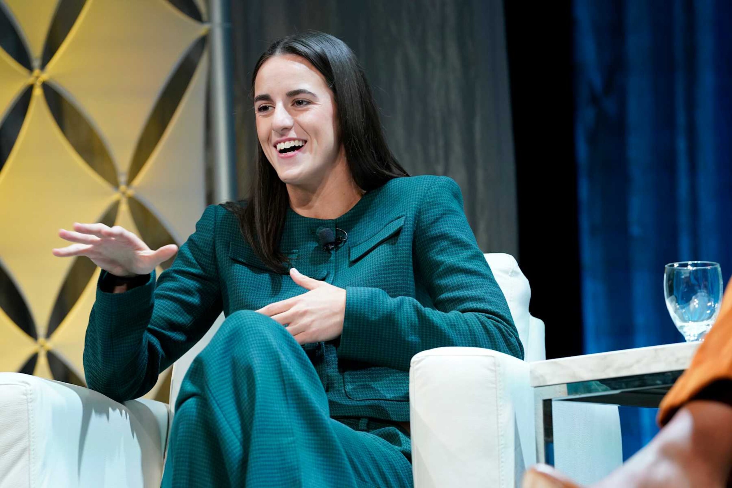 BOSTON, MASSACHUSETTS - DECEMBER 12: Caitlin Clark, Professional Basketball Player, speaks on stage during the 2024 Massachusetts Conference for Women at Boston Convention and Exhibition Center on December 12, 2024 in Boston, Massachusetts. (Photo by Marla Aufmuth/Getty Images for Massachusetts Conference for Women) BOSTON, MASSACHUSETTS - DECEMBER 12: Caitlin Clark, Professional Basketball Player, speaks on stage during the 2024 Massachusetts Conference for Women at Boston Convention and Exhibition Center on December 12, 2024 in Boston, Massachusetts. (Photo by Marla Aufmuth/Getty Images for Massachusetts Conference for Women)