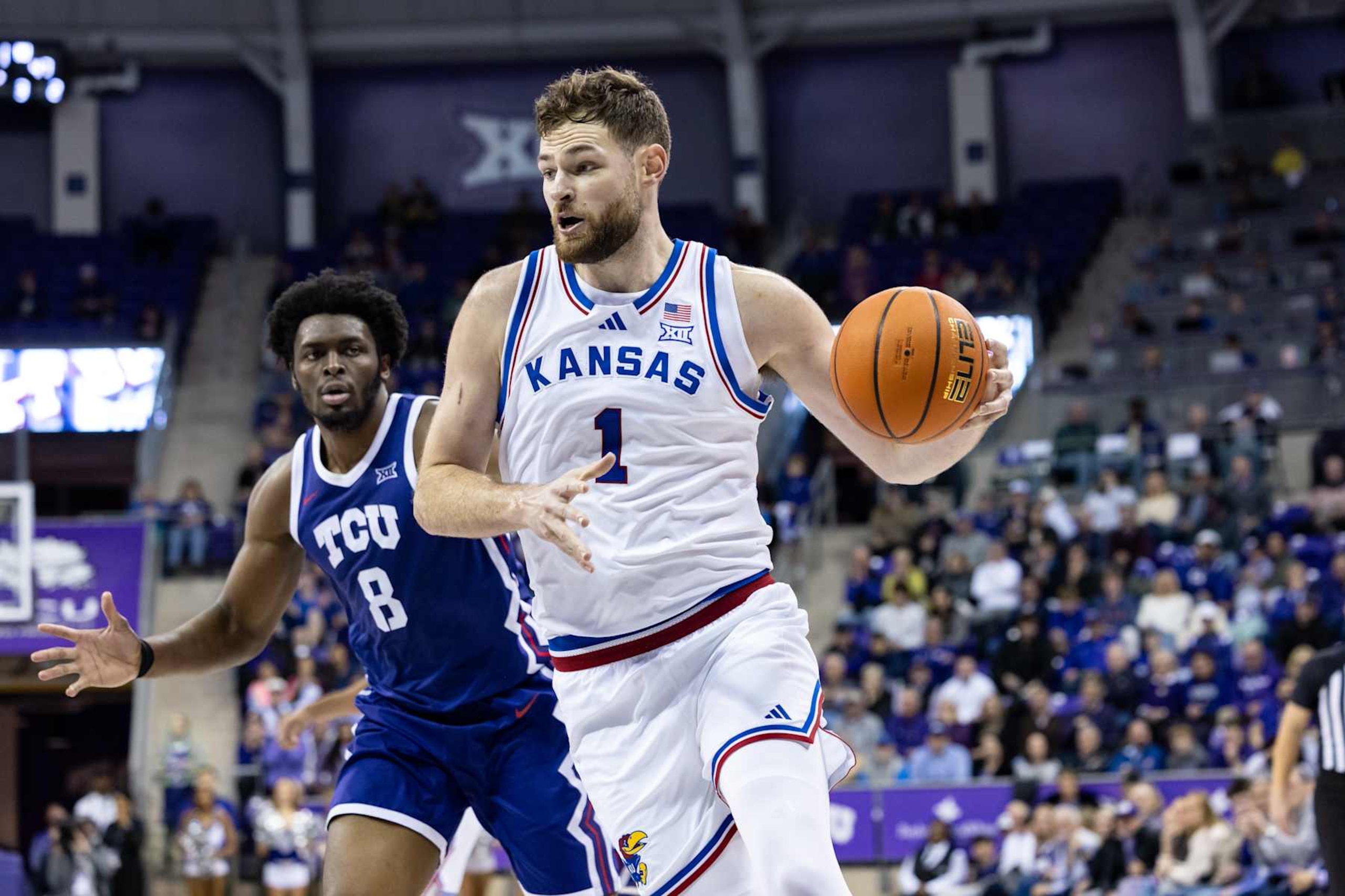 FORT WORTH, TX - JANUARY 22: Kansas Jayhawks center Hunter Dickinson (#1) dribbles toward the basket during the Big 12 college basketball game between the TCU Horned Frogs and Kansas Jayhawks on January 22, 2025 at Ed & Rae Schollmaier Arena in Fort Worth, Texas.  (Photo by Matthew Visinsky/Icon Sportswire via Getty Images)