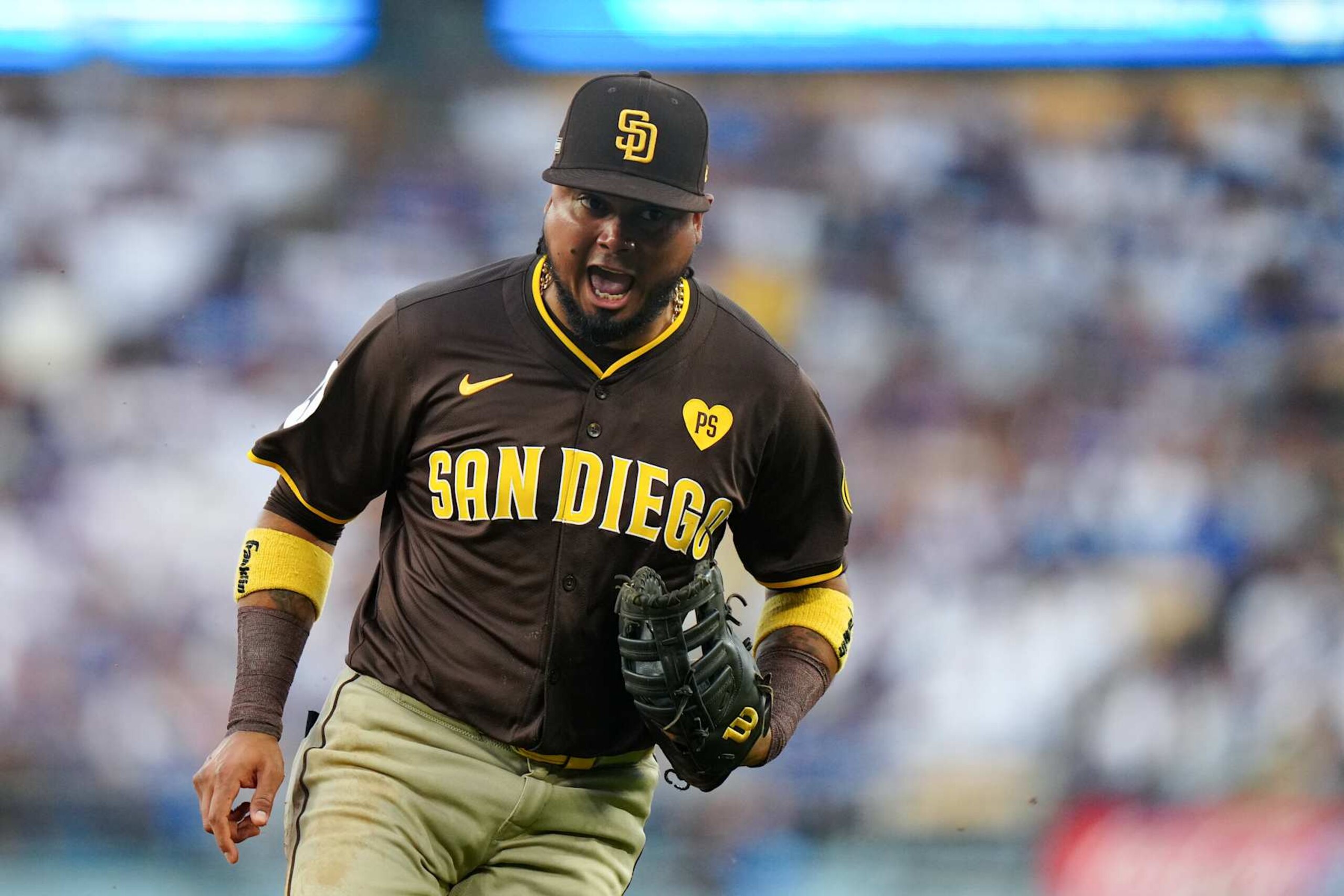 LOS ANGELES, CA - OCTOBER 06: Luis Arraez #4 of the San Diego Padres celebrates after making a play at first base in the fourth inning during Game 2 of the Division Series presented by Booking.com between the San Diego Padres and the Los Angeles Dodgers at Dodger Stadium on Sunday, October 6, 2024 in Los Angeles, California. (Photo by Daniel Shirey/MLB Photos via Getty Images)