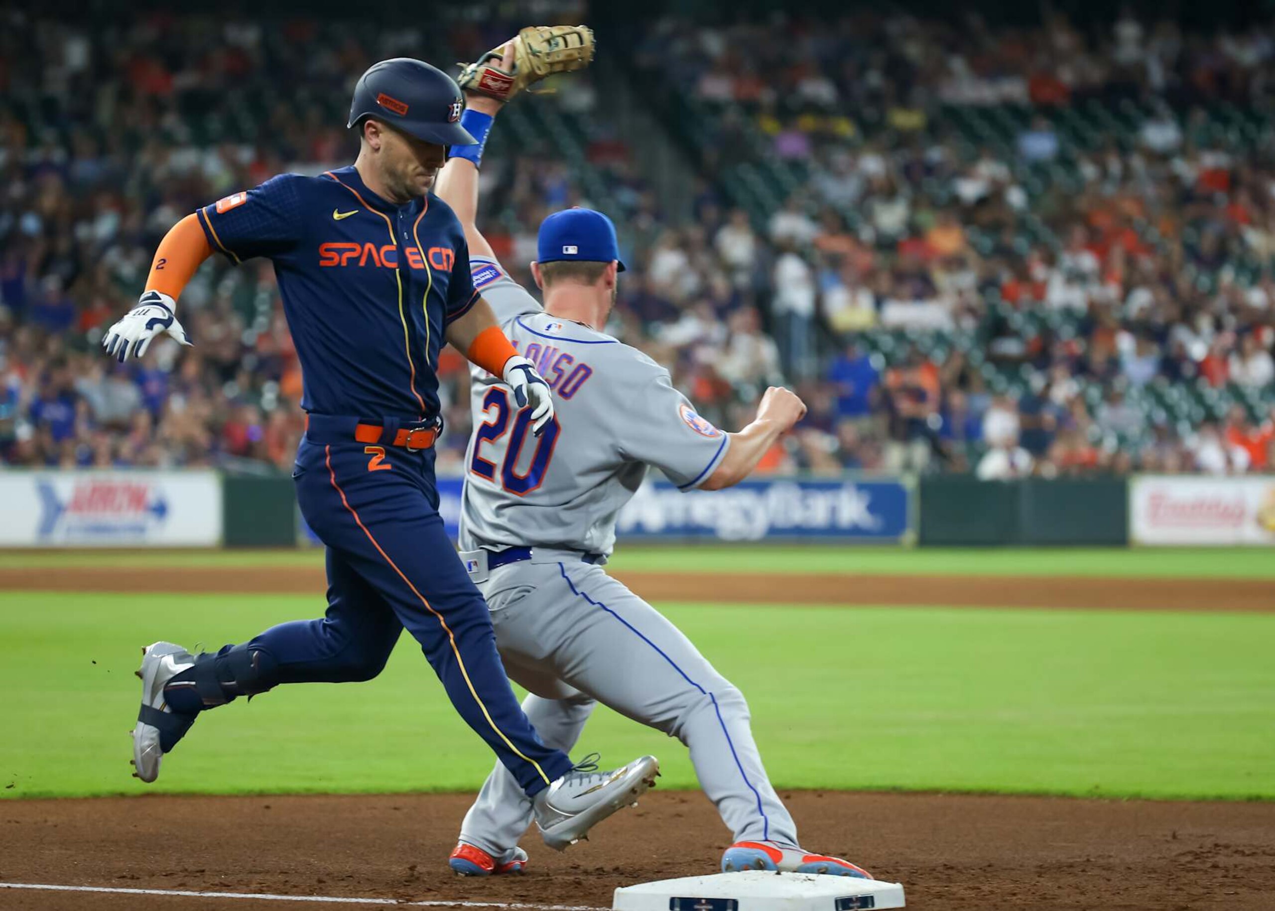 HOUSTON, TX - JUNE 19:  New York Mets first baseman Pete Alonso (20) tags Houston Astros third baseman Alex Bregman (2) in the bottom of the first inning during the MLB game between the New York Mets and Houston Astros on June 19, 2023 at Minute Maid Park in Houston, Texas.  (Photo by Leslie Plaza Johnson/Icon Sportswire via Getty Images)