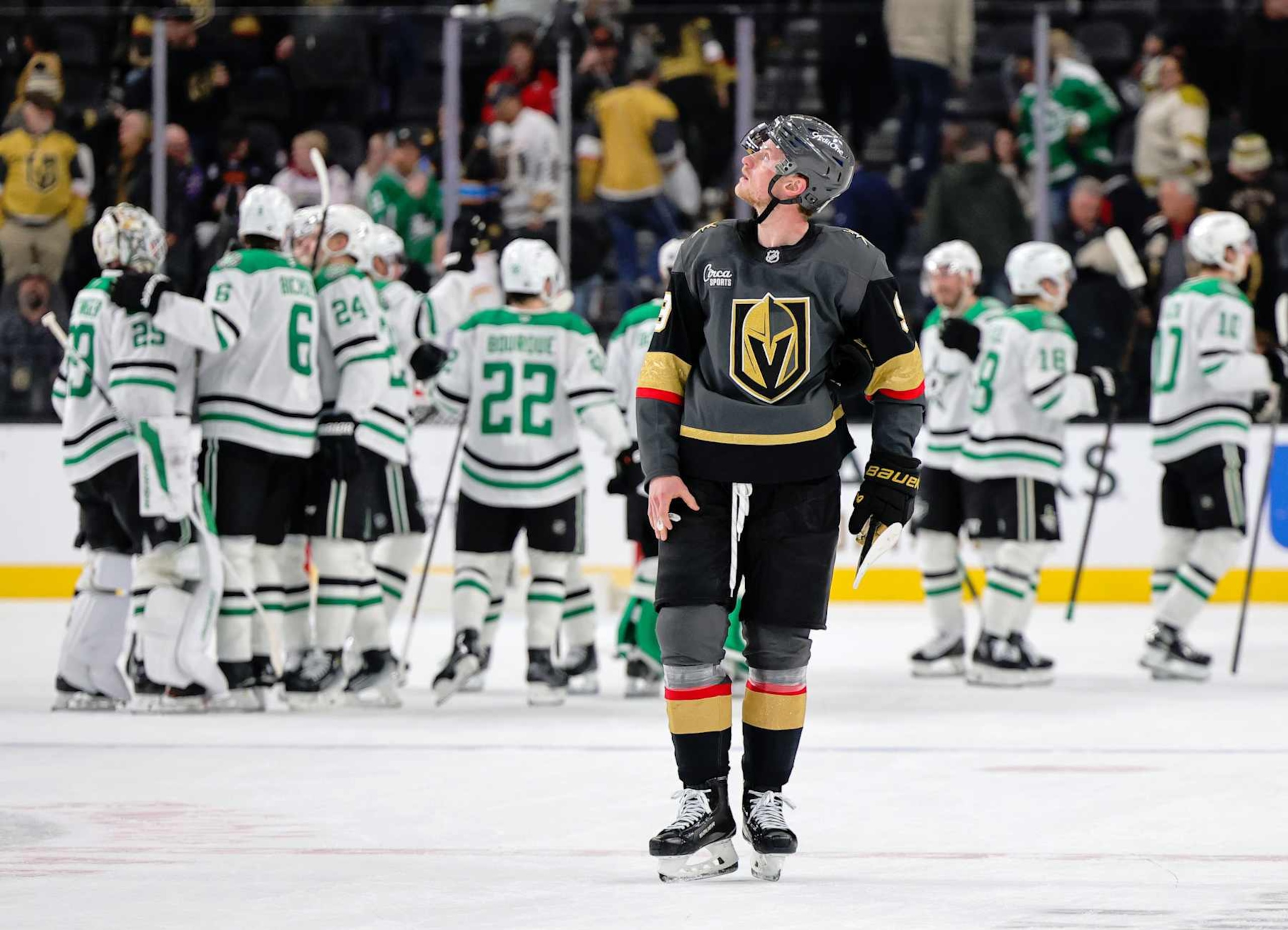 LAS VEGAS, NEVADA - JANUARY 28: Jack Eichel #9 of the Vegas Golden Knights skates off the ice as the Dallas Stars celebrate their 4-3 overtime victory over the Golden Knights behind him at T-Mobile Arena on January 28, 2025 in Las Vegas, Nevada. (Photo by Ethan Miller/Getty Images)