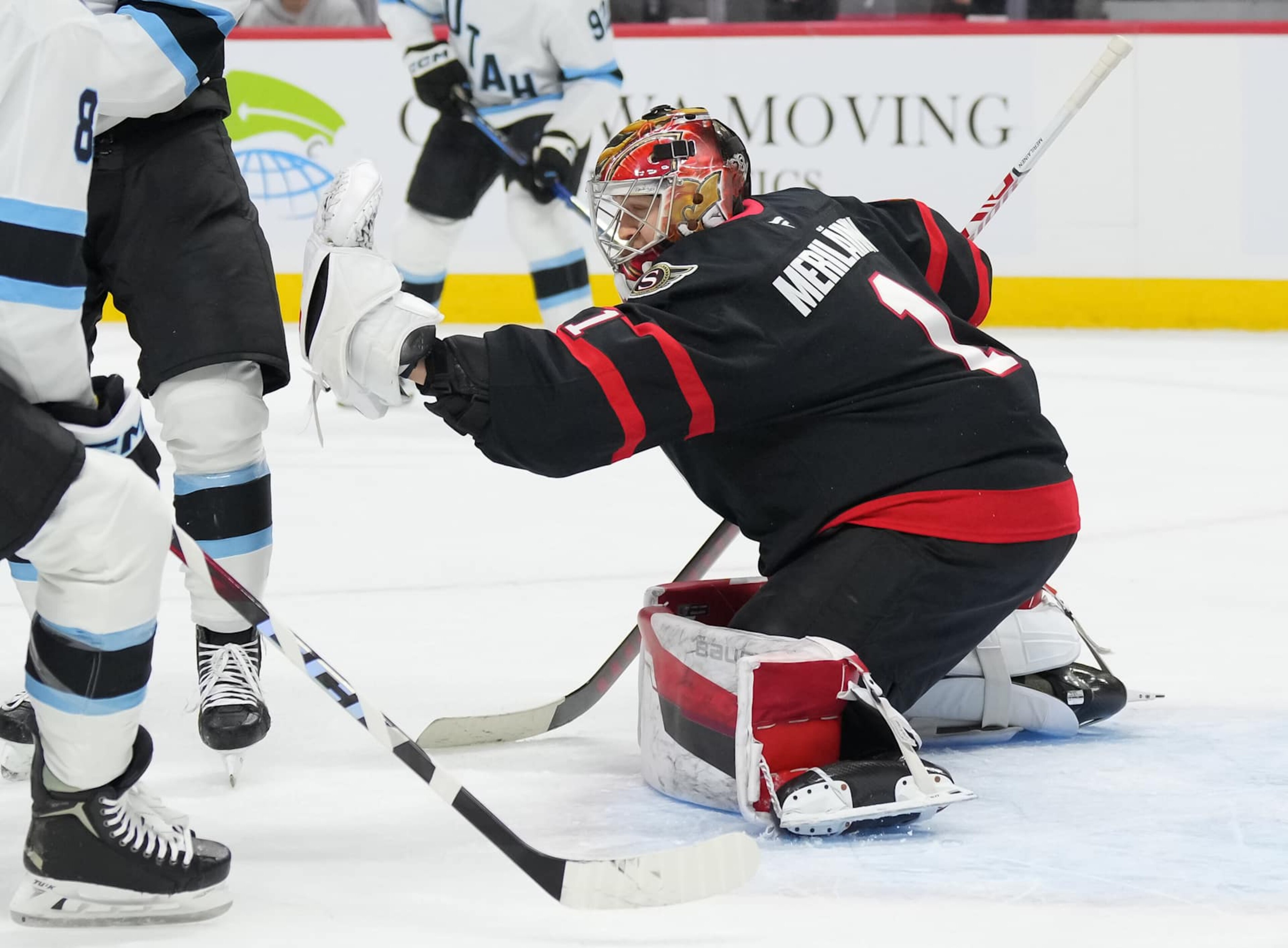 OTTAWA, CANADA - JANUARY 26: Leevi Merilainen #1 of the Ottawa Senators makes a glove save against the Utah Hockey Club in the first period at Canadian Tire Centre on January 26, 2025 in Ottawa, Ontario, Canada. (Photo by Chris Tanouye/Freestyle Photography/Getty Images)