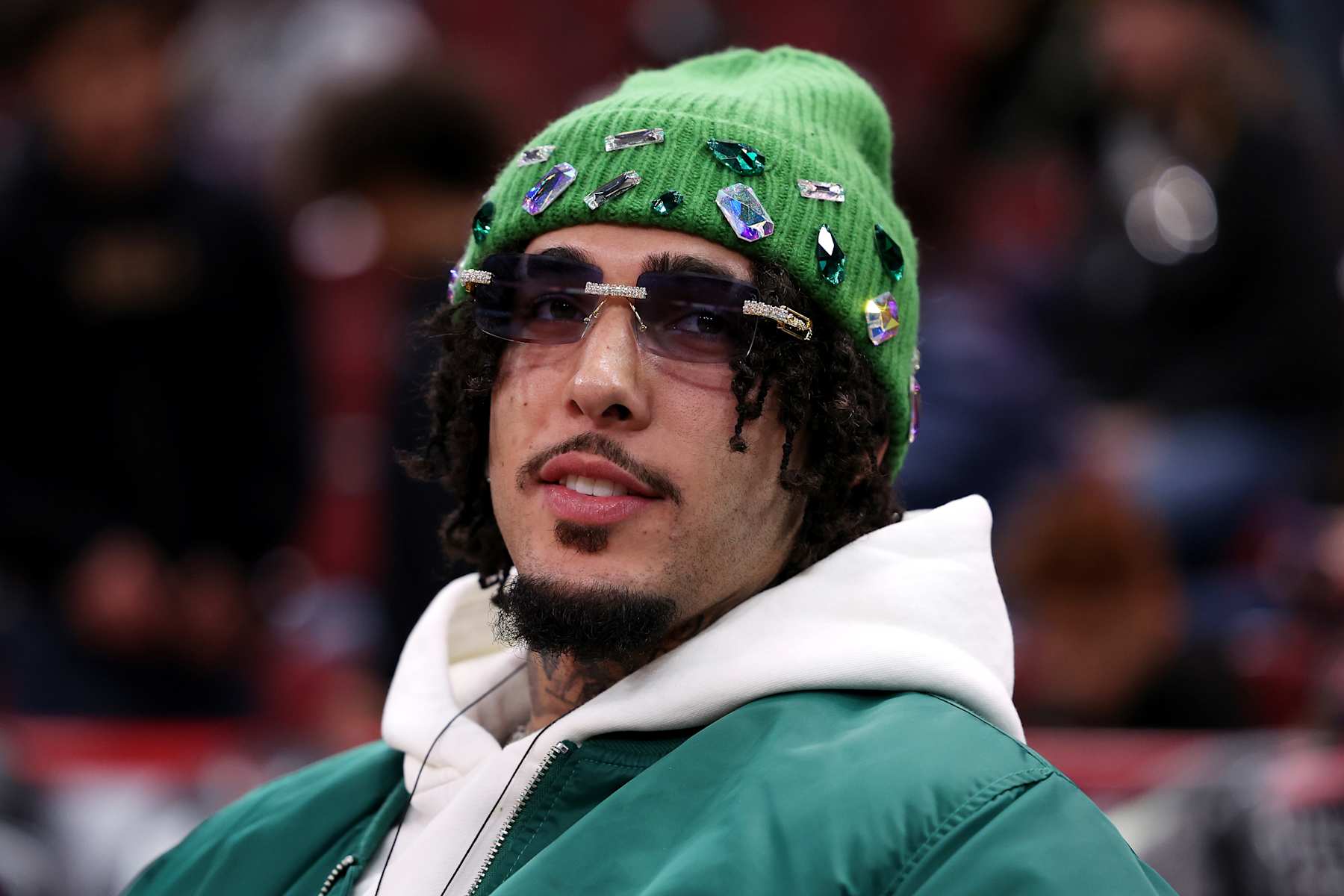 CHICAGO, ILLINOIS - JANUARY 17: Rapper and former basketball player LiAngelo Ball, also known by his stage name G3 GELO, looks on before the game between the Chicago Bulls and the Charlotte Hornets at the United Center on January 17, 2025 in Chicago, Illinois. NOTE TO USER: User expressly acknowledges and agrees that, by downloading and or using this photograph, user is consenting to the terms and conditions of the Getty Images License Agreement.  (Photo by Luke Hales/Getty Images)