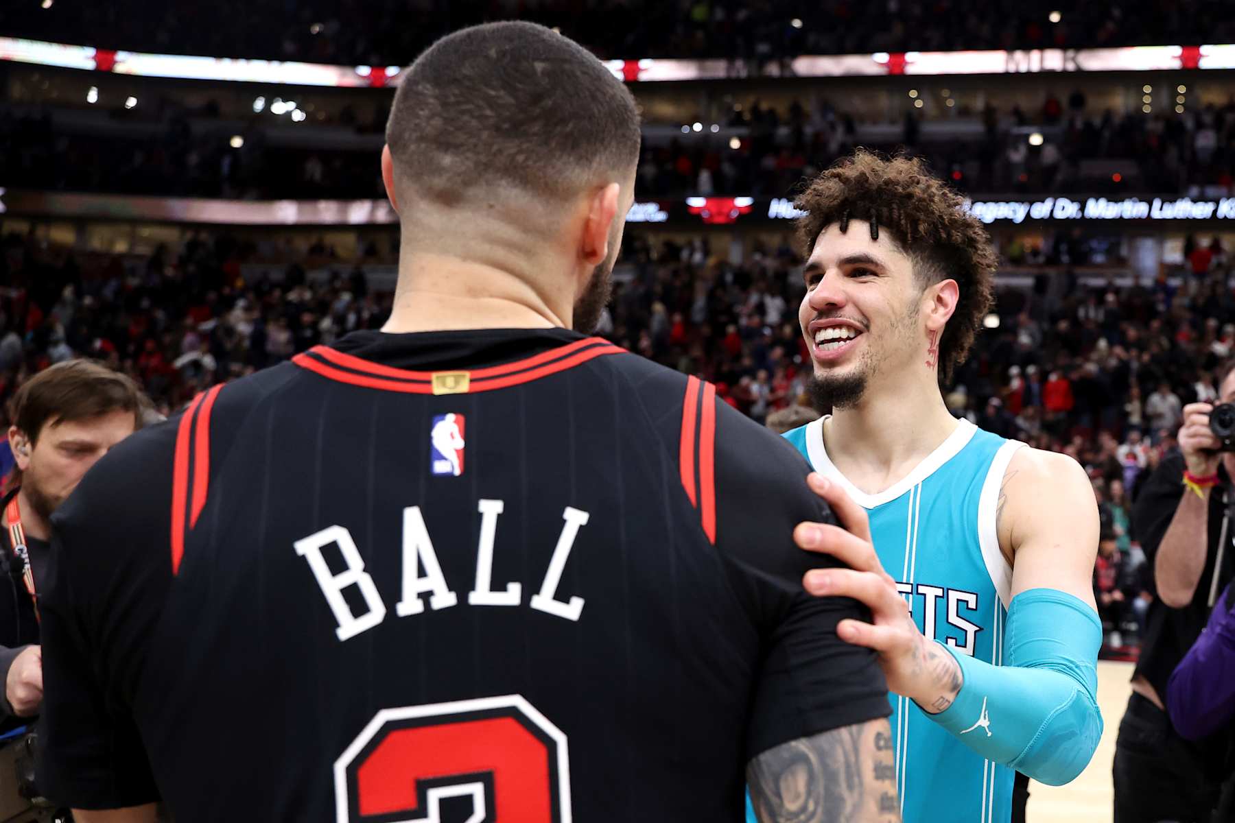 CHICAGO, ILLINOIS - JANUARY 17: Lonzo Ball #2 of the Chicago Bulls embraces LaMelo Ball #1 of the Charlotte Hornets after the game at the United Center on January 17, 2025 in Chicago, Illinois. NOTE TO USER: User expressly acknowledges and agrees that, by downloading and or using this photograph, user is consenting to the terms and conditions of the Getty Images License Agreement.  (Photo by Luke Hales/Getty Images)