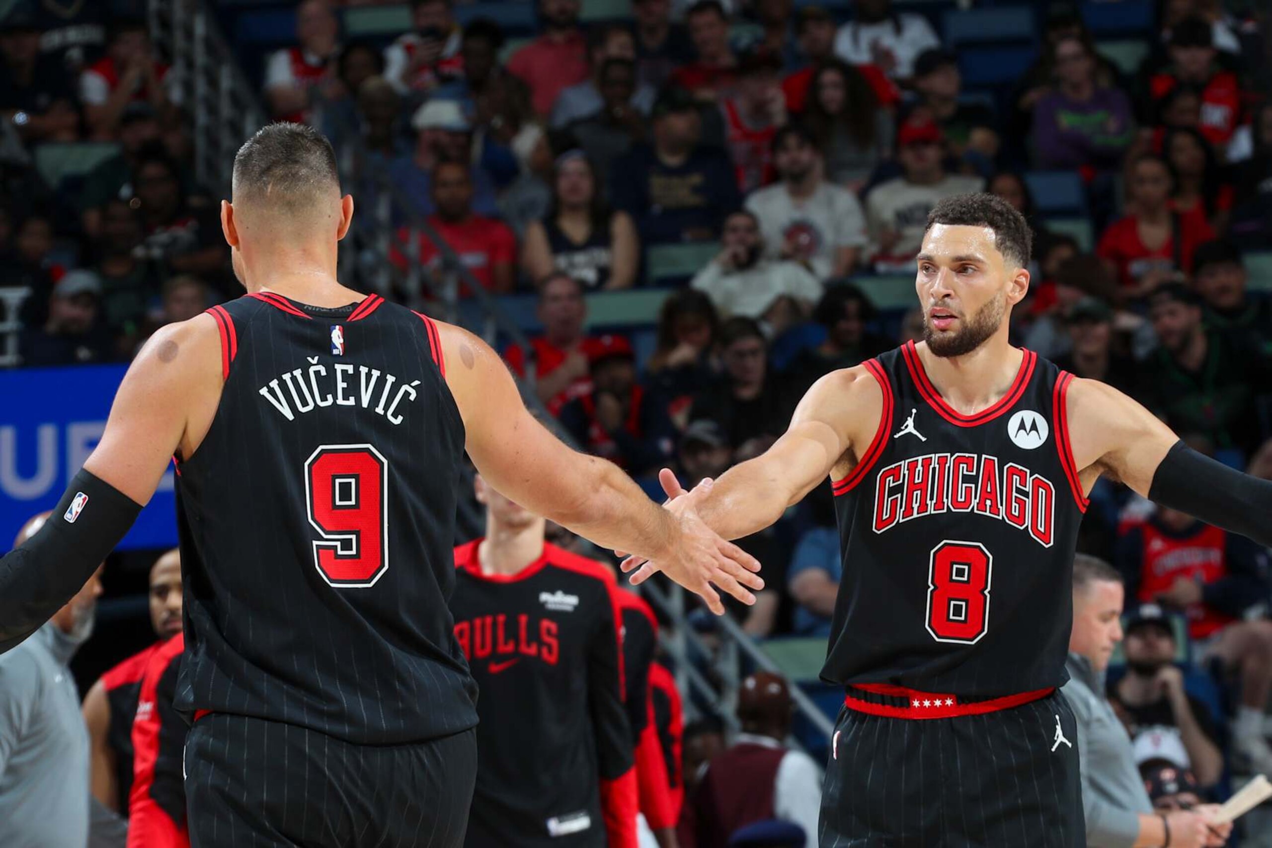NEW ORLEANS, LA - OCTOBER 23: Zach LaVine #8 and Nikola Vucevic #9 of the Chicago Bulls high-five during the game on October 23, 2024 at the Smoothie King Center in New Orleans, Louisiana. NOTE TO USER: User expressly acknowledges and agrees that, by downloading and or using this Photograph, user is consenting to the terms and conditions of the Getty Images License Agreement. Mandatory Copyright Notice: Copyright 2024 NBAE (Photo by Layne Murdoch Jr./NBAE via Getty Images) NEW ORLEANS, LA - OCTOBER 23: Zach LaVine #8 and Nikola Vucevic #9 of the Chicago Bulls high-five during the game on October 23, 2024 at the Smoothie King Center in New Orleans, Louisiana. NOTE TO USER: User expressly acknowledges and agrees that, by downloading and or using this Photograph, user is consenting to the terms and conditions of the Getty Images License Agreement. Mandatory Copyright Notice: Copyright 2024 NBAE (Photo by Layne Murdoch Jr./NBAE via Getty Images)