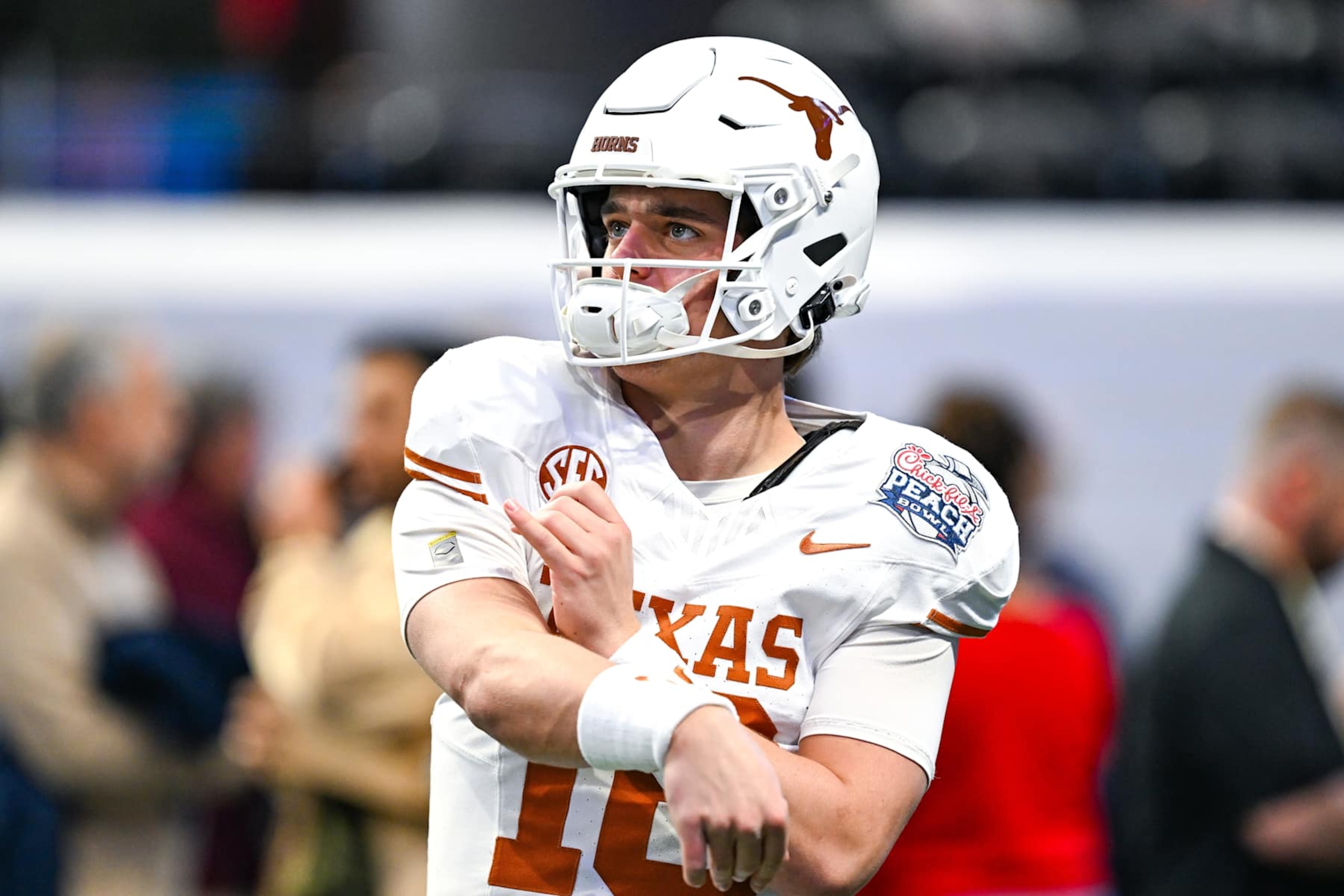 ATLANTA, GA JANUARY 01: Quarterback Arch Manning #16 of the Texas Longhorns warms up prior to the start of the Texas Longhorns versus Arizona State Sun Devils College Football Playoff Quarterfinal at the Chick-fil-A Peach Bowl on January 1, 2025, at Mercedes-Benz Stadium in Atlanta, GA. (Photo by Rich von Biberstein/Icon Sportswire via Getty Images) ATLANTA, GA JANUARY 01: Quarterback Arch Manning #16 of the Texas Longhorns warms up prior to the start of the Texas Longhorns versus Arizona State Sun Devils College Football Playoff Quarterfinal at the Chick-fil-A Peach Bowl on January 1, 2025, at Mercedes-Benz Stadium in Atlanta, GA. (Photo by Rich von Biberstein/Icon Sportswire via Getty Images)