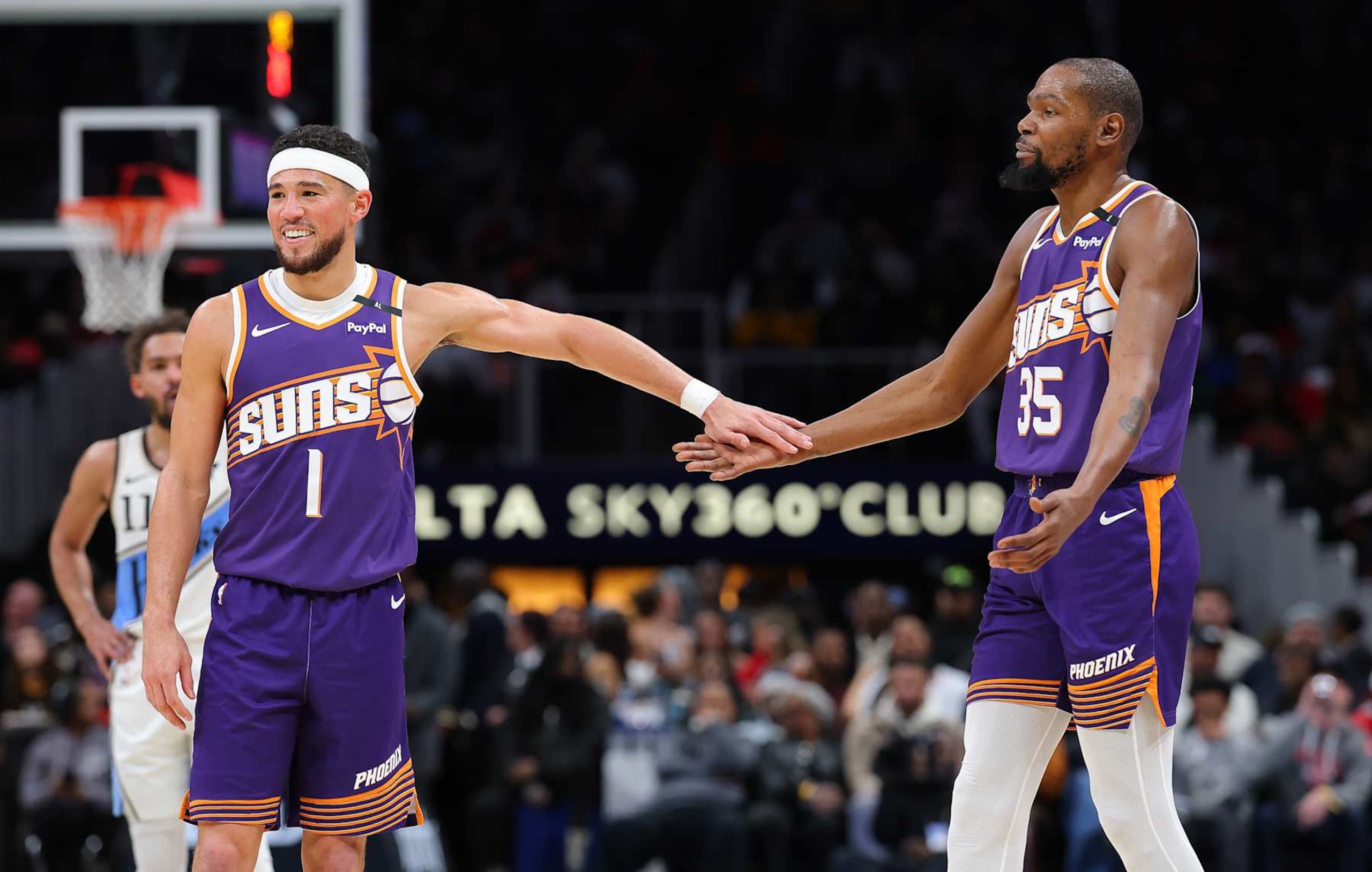 ATLANTA, GEORGIA - JANUARY 14: Devin Booker #1 and Kevin Durant #35 of the Phoenix Suns reacts against the Atlanta Hawks during the third quarter at State Farm Arena on January 14, 2025 in Atlanta, Georgia. NOTE TO USER: User expressly acknowledges and agrees that, by downloading and/or using this photograph, user is consenting to the terms and conditions of the Getty Images License Agreement. (Photo by Kevin C. Cox/Getty Images) ATLANTA, GEORGIA - JANUARY 14: Devin Booker #1 and Kevin Durant #35 of the Phoenix Suns reacts against the Atlanta Hawks during the third quarter at State Farm Arena on January 14, 2025 in Atlanta, Georgia. NOTE TO USER: User expressly acknowledges and agrees that, by downloading and/or using this photograph, user is consenting to the terms and conditions of the Getty Images License Agreement. (Photo by Kevin C. Cox/Getty Images)
