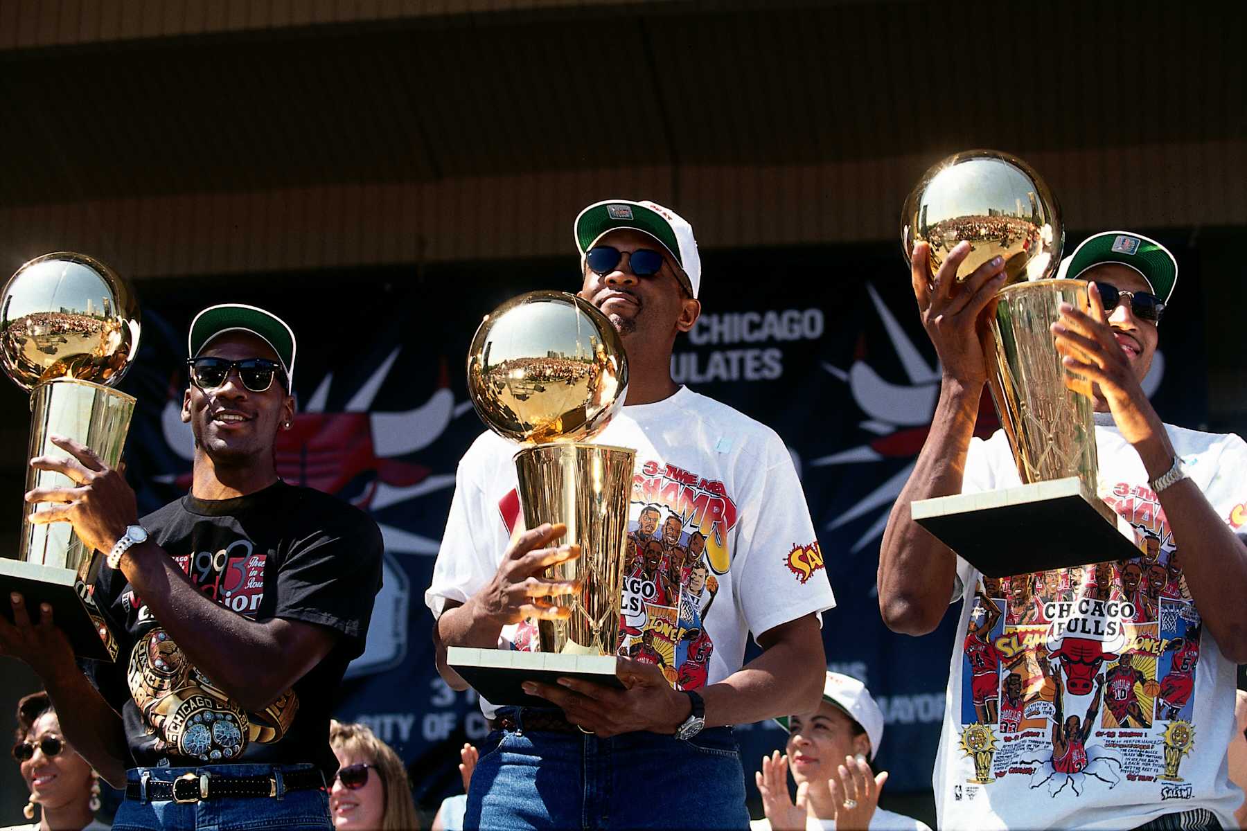 CHICAGO - JUNE 26:  (L-R) Michael Jordan, Bill Cartwright and Scottie Pippen of the Chicago Bulls celebrates during a rally after the Bulls defeated the Phoenix Suns in six games in the 1993 NBA Finals on June 26, 1993 in Chicago, Illinois.  NOTE TO USER: User expressly acknowledges and agrees that, by downloading and/or using this Photograph, user is consenting to the terms and conditions of the Getty Images License Agreement.  Mandatory Copyright Notice: Copyright 1993 NBAE (Photo by Lou Capozzola/NBAE via Getty Images)