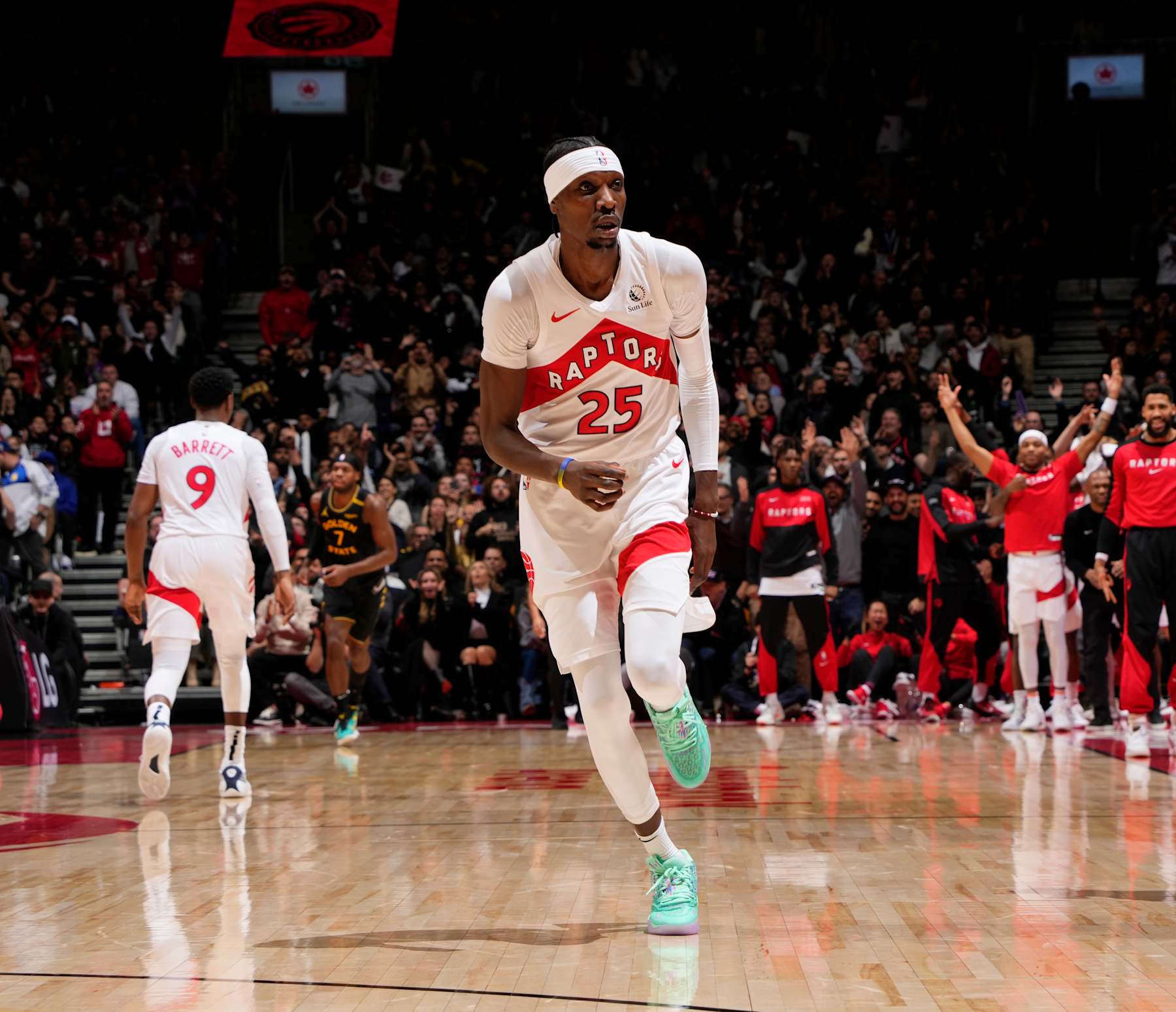 TORONTO, CANADA - JANUARY 13:  Chris Boucher #25 of the Toronto Raptors celebrates during the game against the Golden State Warriors on January 13, 2025 at the Scotiabank Arena in Toronto, Ontario, Canada.  NOTE TO USER: User expressly acknowledges and agrees that, by downloading and or using this Photograph, user is consenting to the terms and conditions of the Getty Images License Agreement.  Mandatory Copyright Notice: Copyright 2025 NBAE (Photo by Mark Blinch/NBAE via Getty Images)