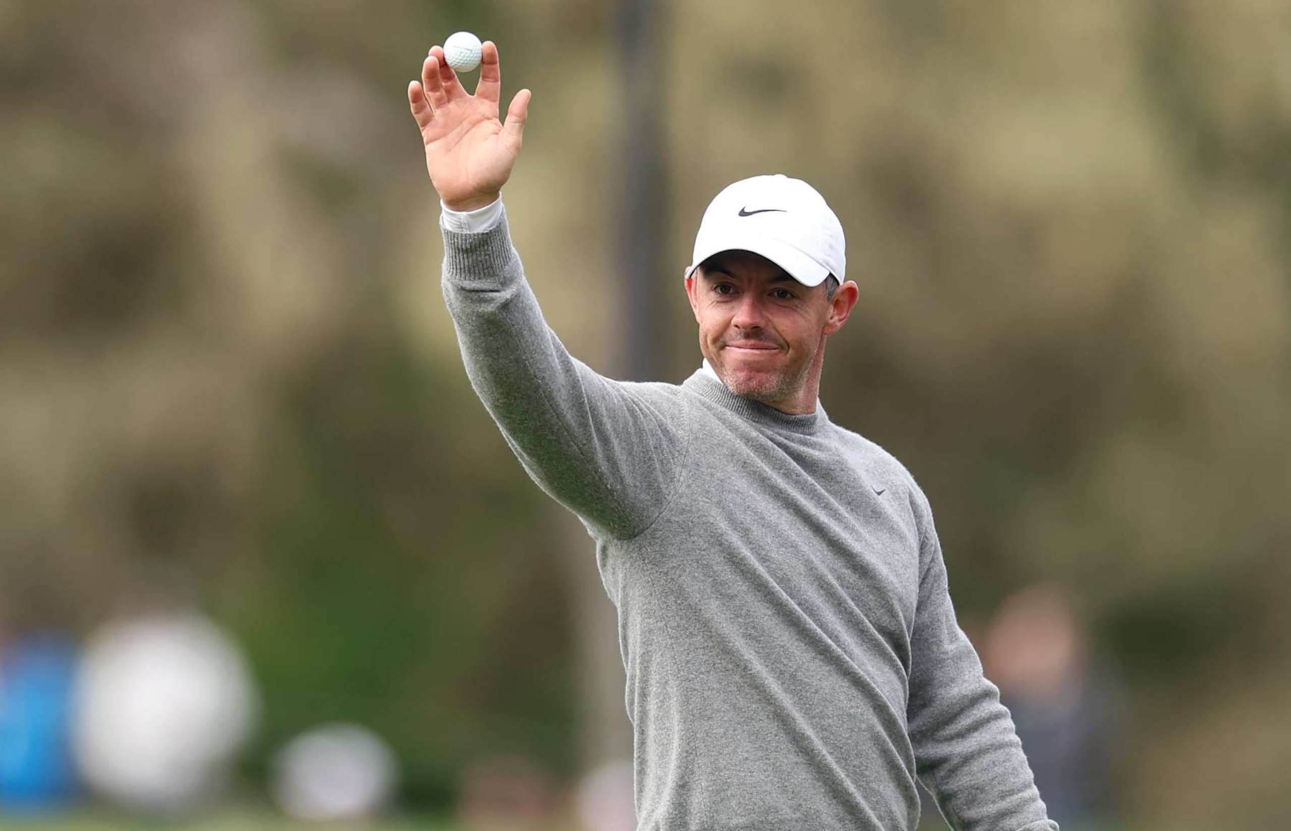 PEBBLE BEACH, CALIFORNIA - JANUARY 30: Rory McIlroy of Northern Ireland acknowledges the crowd after a hole-in-one on the 15th hole during the first round of the AT&T Pebble Beach Pro-Am 2025 at Spyglass Hill golf course on January 30, 2025 in Pebble Beach, California. (Photo by Ezra Shaw/Getty Images)