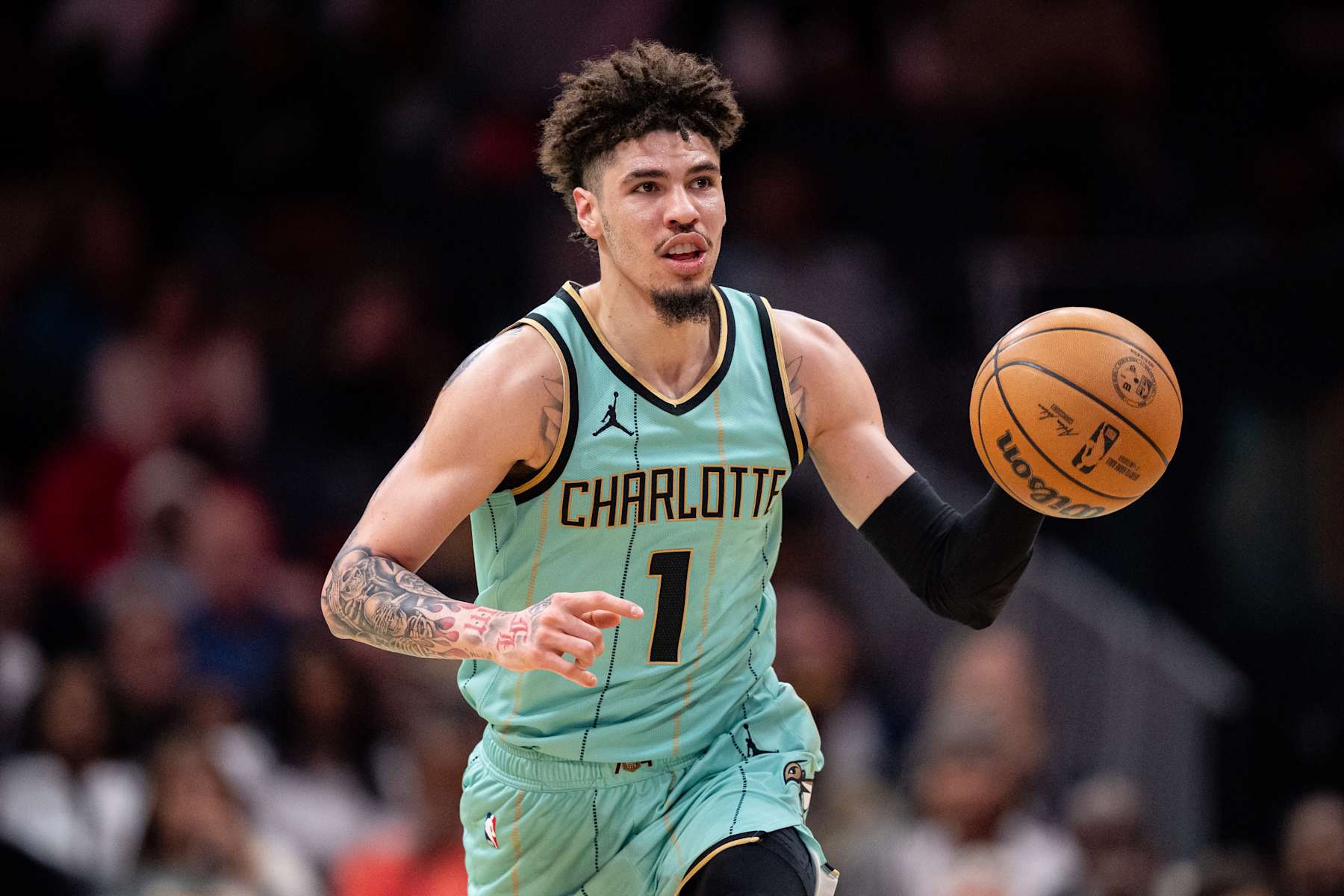 CHARLOTTE, NORTH CAROLINA - JANUARY 25: LaMelo Ball #1 of the Charlotte Hornets plays against the New Orleans Pelicans during their game at Spectrum Center on January 25, 2025 in Charlotte, North Carolina. NOTE TO USER: User expressly acknowledges and agrees that, by downloading and or using this photograph, User is consenting to the terms and conditions of the Getty Images License Agreement. (Photo by Jacob Kupferman/Getty Images)