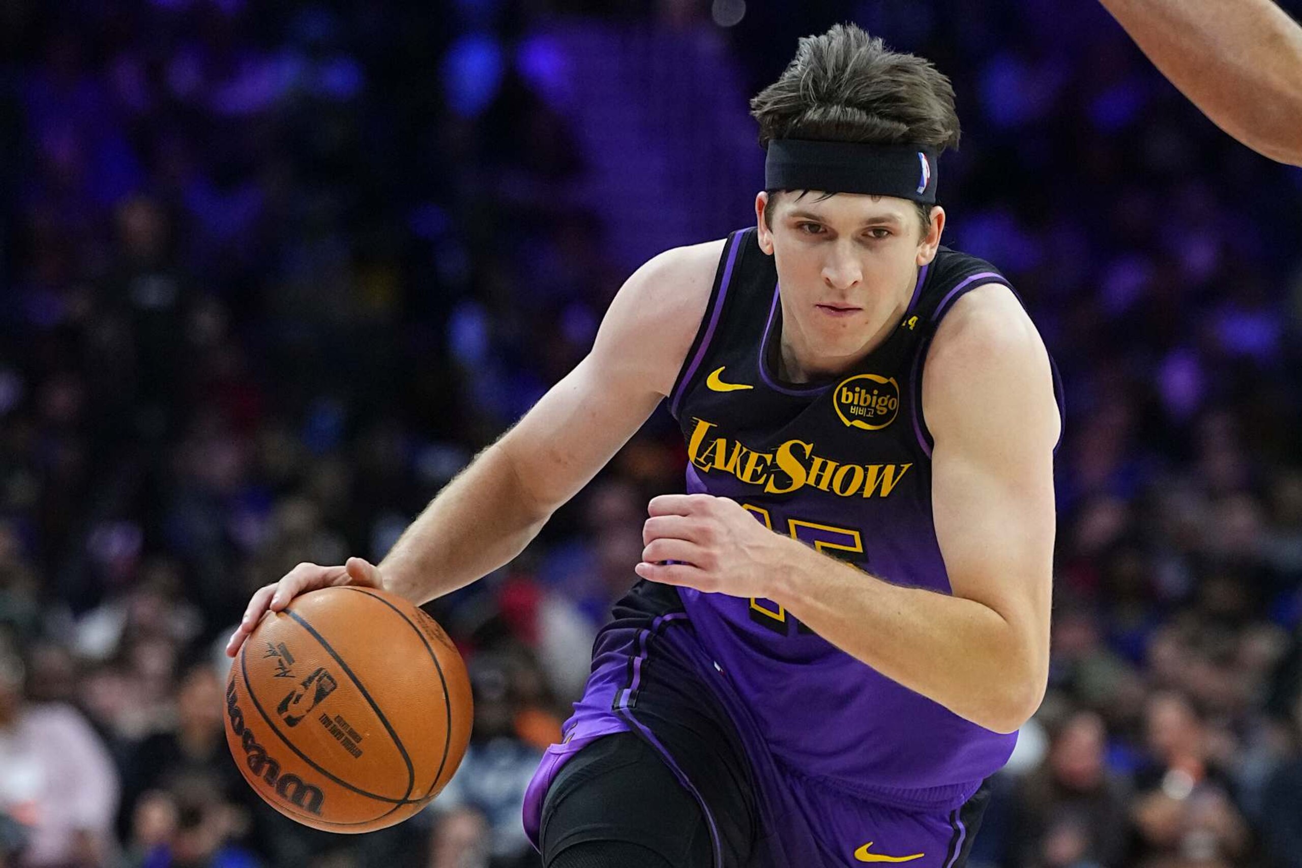PHILADELPHIA, PENNSYLVANIA - JANUARY 28: Austin Reaves #15 of the Los Angeles Lakers dribbles the ball against the Philadelphia 76ers at the Wells Fargo Center on January 28, 2025 in Philadelphia, Pennsylvania. The 76ers defeated the Lakers 118-104. NOTE TO USER: User expressly acknowledges and agrees that, by downloading and/or using this photograph, user is consenting to the terms and conditions of the Getty Images License Agreement. (Photo by Mitchell Leff/Getty Images)