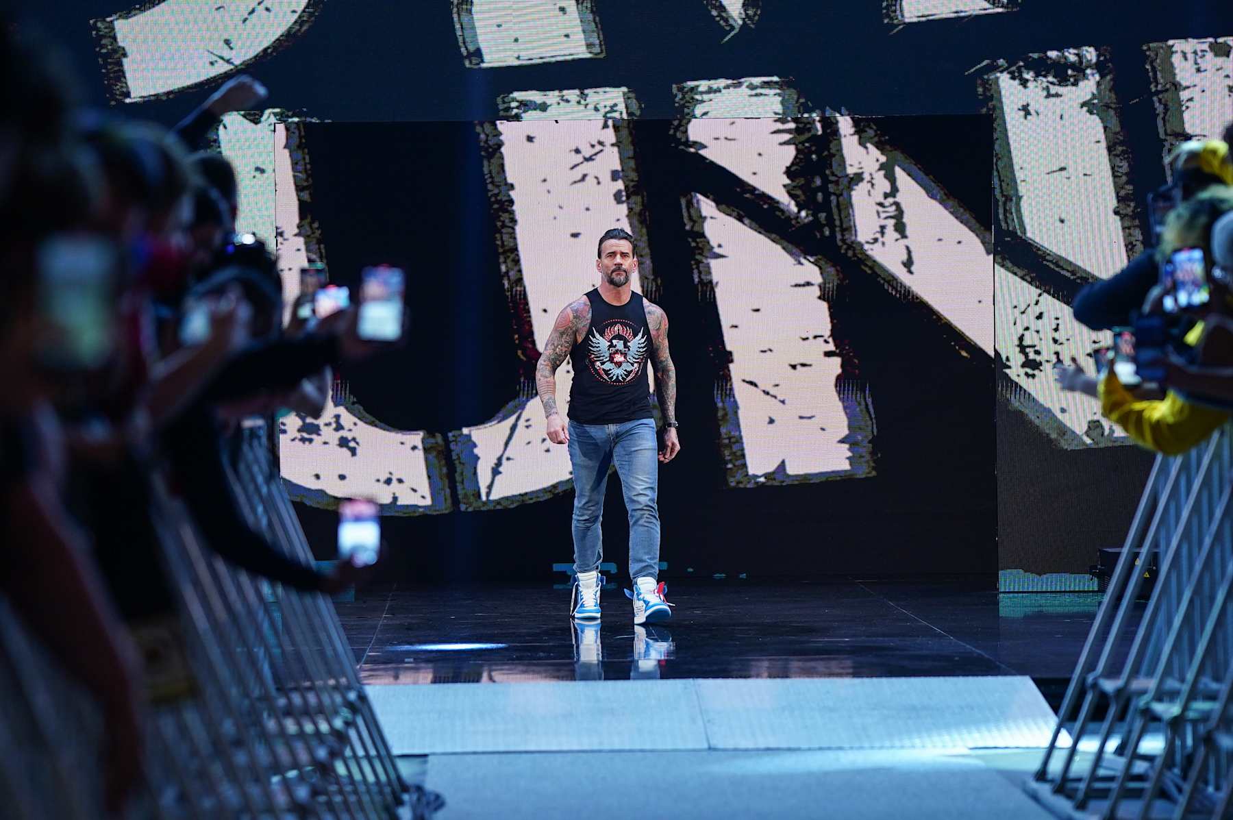 ATLANTA, GEORGIA - JANUARY 27: CM Punk makes his entrance during WWE Monday Night RAW at State Farm Arena on January 27, 2025 in Atlanta, Georgia. (Photo by WWE/Getty Images)