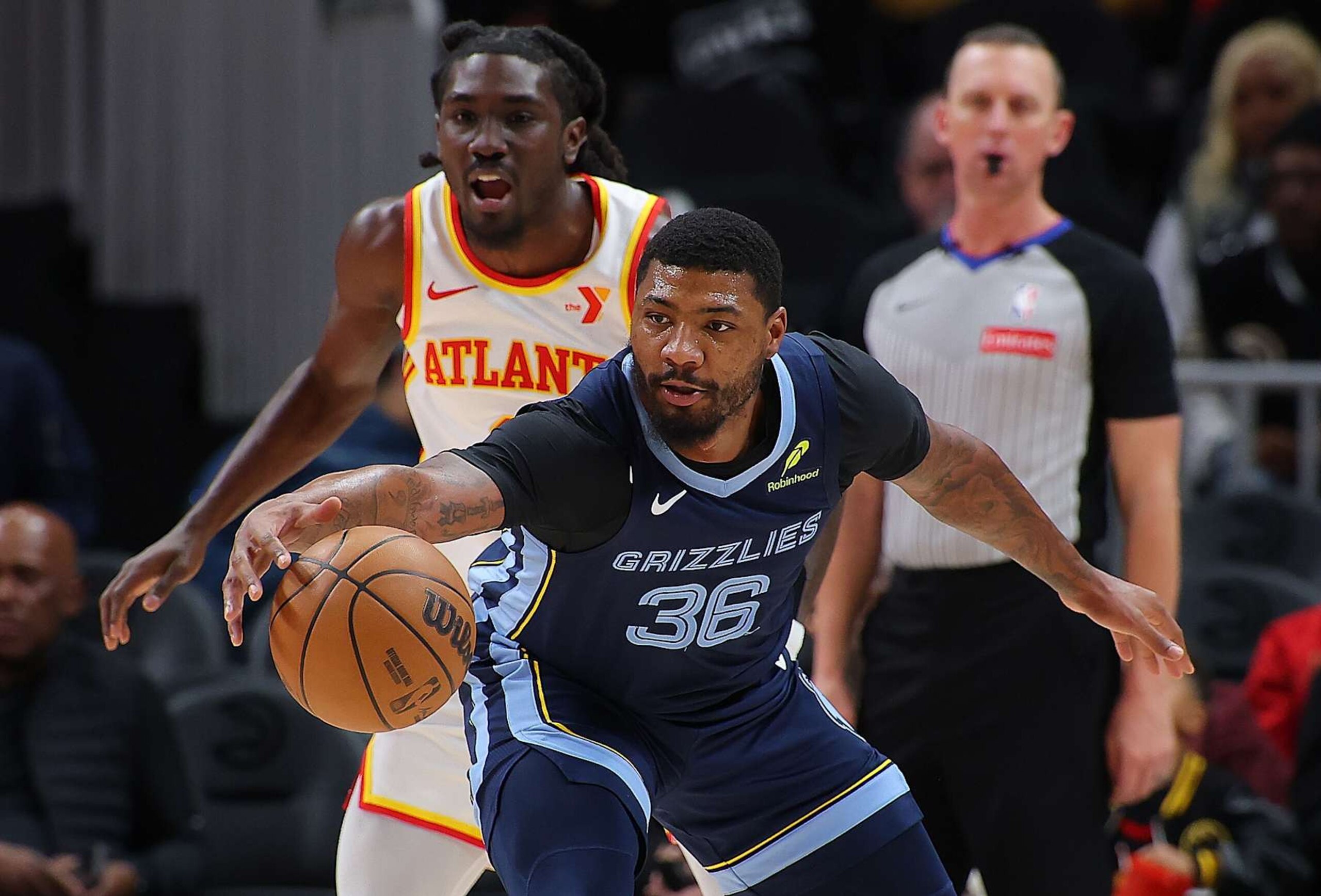 ATLANTA, GEORGIA - DECEMBER 21: Marcus Smart #36 of the Memphis Grizzlies catches a pass against Keaton Wallace #2 of the Atlanta Hawks during the first quarter at State Farm Arena on December 21, 2024 in Atlanta, Georgia. NOTE TO USER: User expressly acknowledges and agrees that, by downloading and/or using this photograph, user is consenting to the terms and conditions of the Getty Images License Agreement. (Photo by Kevin C. Cox/Getty Images) ATLANTA, GEORGIA - DECEMBER 21: Marcus Smart #36 of the Memphis Grizzlies catches a pass against Keaton Wallace #2 of the Atlanta Hawks during the first quarter at State Farm Arena on December 21, 2024 in Atlanta, Georgia. NOTE TO USER: User expressly acknowledges and agrees that, by downloading and/or using this photograph, user is consenting to the terms and conditions of the Getty Images License Agreement. (Photo by Kevin C. Cox/Getty Images)