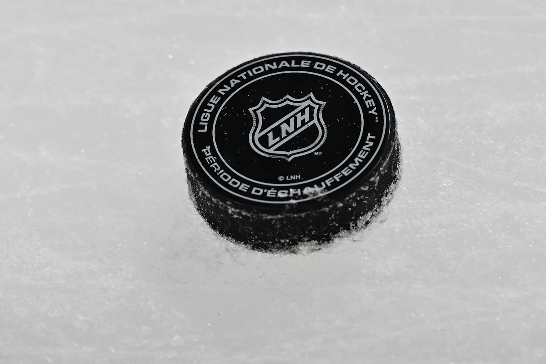 MONTREAL, CANADA - NOVEMBER 18:  A puck is seen on the ice during warmups prior to the game between the Montreal Canadiens and the Edmonton Oilers at the Bell Centre on November 18, 2024 in Montreal, Quebec, Canada.  The Montreal Canadiens defeated the Edmonton Oilers 3-0.  (Photo by Minas Panagiotakis/Getty Images)