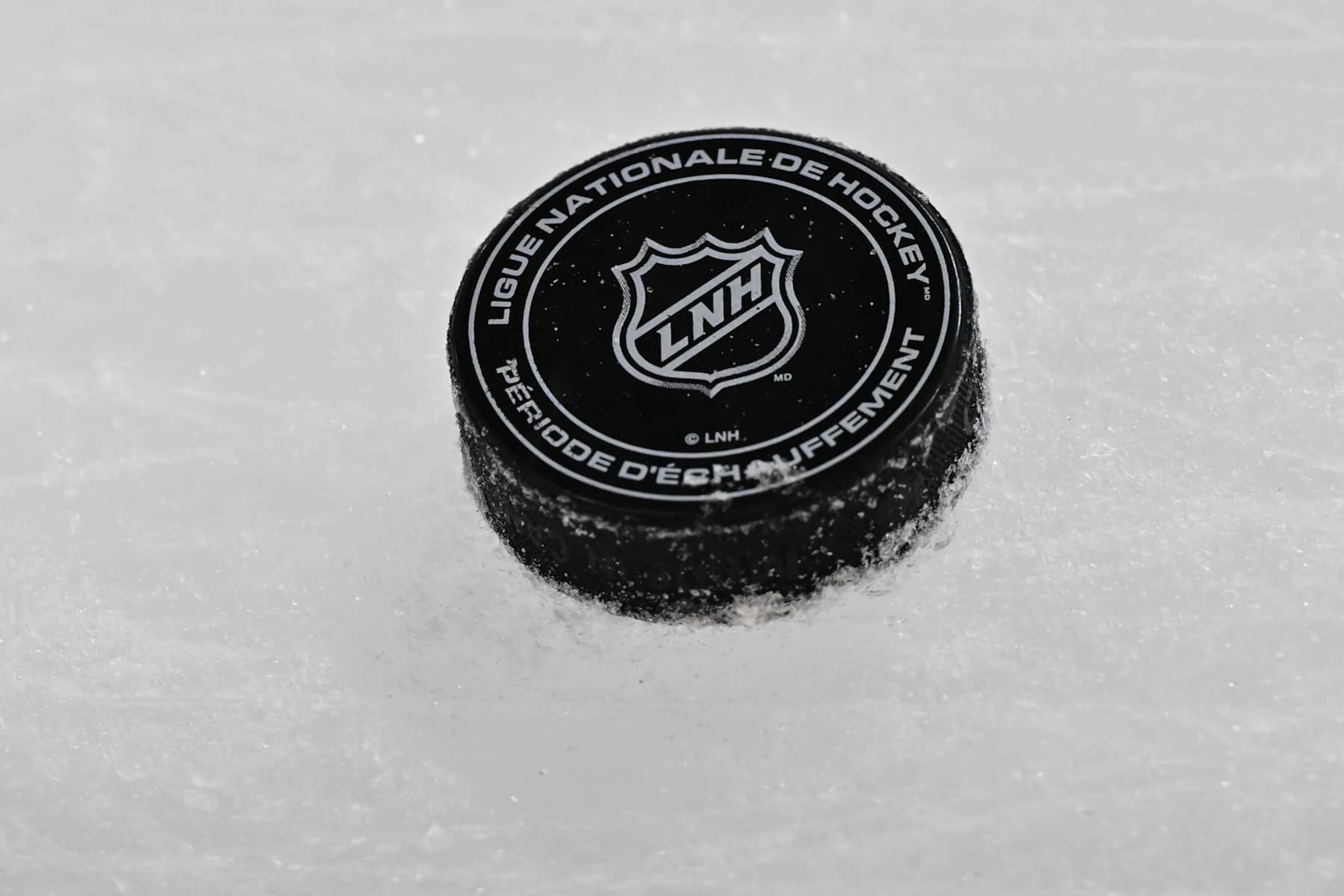 MONTREAL, CANADA - NOVEMBER 18:  A puck is seen on the ice during warmups prior to the game between the Montreal Canadiens and the Edmonton Oilers at the Bell Centre on November 18, 2024 in Montreal, Quebec, Canada.  The Montreal Canadiens defeated the Edmonton Oilers 3-0.  (Photo by Minas Panagiotakis/Getty Images)