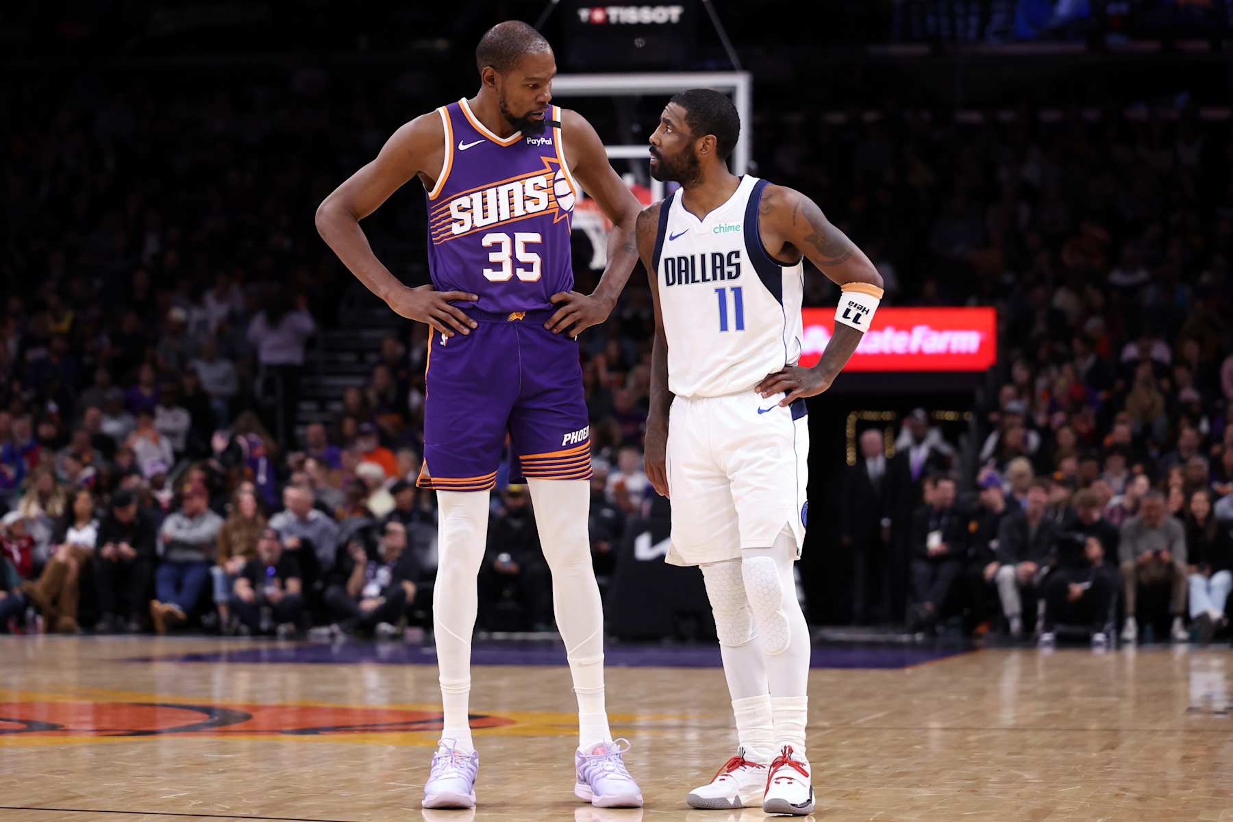 PHOENIX, ARIZONA - DECEMBER 27: Kevin Durant #35 of the Phoenix Suns talks with Kyrie Irving #11 of the Dallas Mavericks during the second half at Footprint Center on December 27, 2024 in Phoenix, Arizona. NOTE TO USER: User expressly acknowledges and agrees that, by downloading and or using this photograph, User is consenting to the terms and conditions of the Getty Images License Agreement.  (Photo by Chris Coduto/Getty Images)