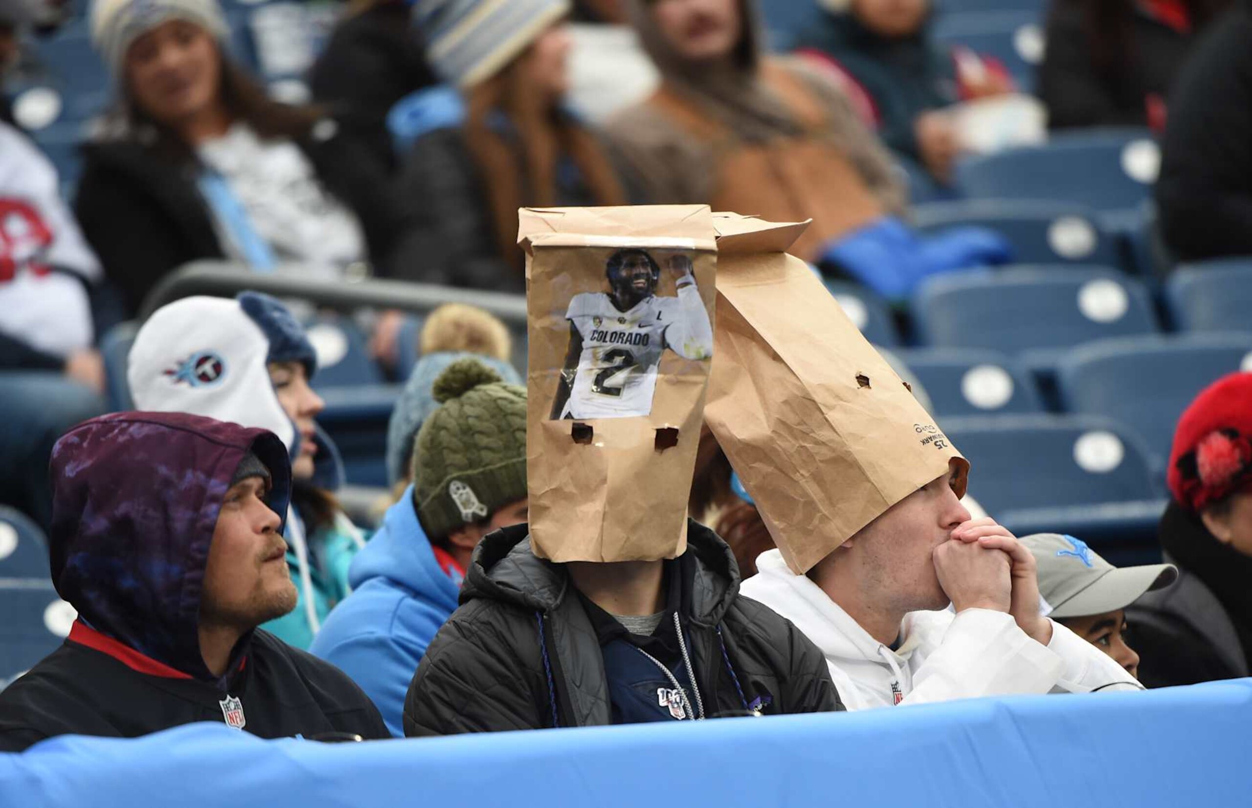 NASHVILLE, TN - JANUARY 5: Tennessee Titans fans wear paper bags featuring Shedeur Sanders during game featuring the Houston Texans and the Tennessee Titans on January 5, 2025 at Nissan Stadium in Nashville, TN. (Photo by John Rivera/Icon Sportswire via Getty Images) NASHVILLE, TN - JANUARY 5: Tennessee Titans fans wear paper bags featuring Shedeur Sanders during game featuring the Houston Texans and the Tennessee Titans on January 5, 2025 at Nissan Stadium in Nashville, TN. (Photo by John Rivera/Icon Sportswire via Getty Images)