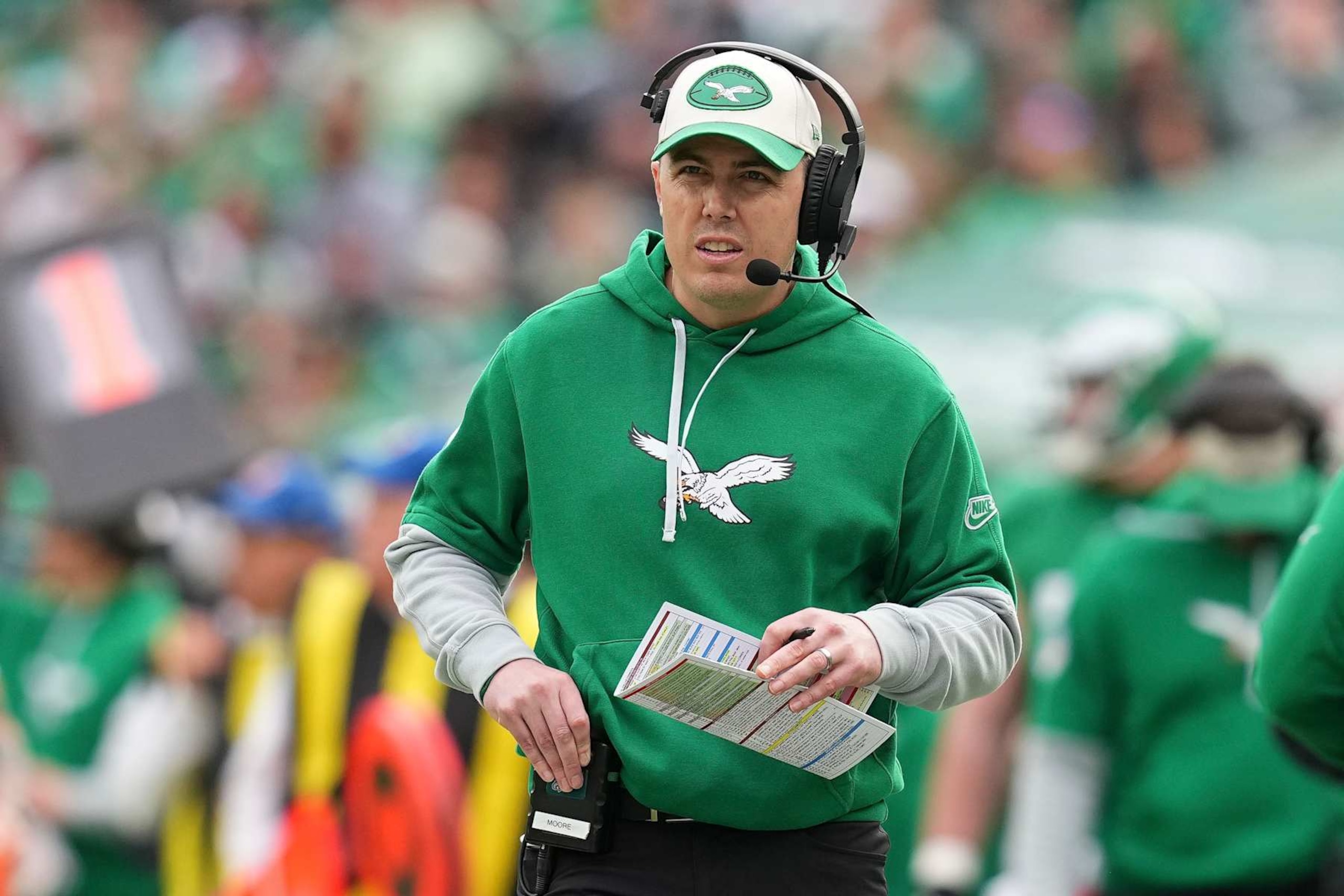 PHILADELPHIA, PENNSYLVANIA - DECEMBER 29: Offensive coordinator Kellen Moore of the Philadelphia Eagles looks on against the Dallas Cowboys at Lincoln Financial Field on December 29, 2024 in Philadelphia, Pennsylvania. (Photo by Mitchell Leff/Getty Images) PHILADELPHIA, PENNSYLVANIA - DECEMBER 29: Offensive coordinator Kellen Moore of the Philadelphia Eagles looks on against the Dallas Cowboys at Lincoln Financial Field on December 29, 2024 in Philadelphia, Pennsylvania. (Photo by Mitchell Leff/Getty Images)