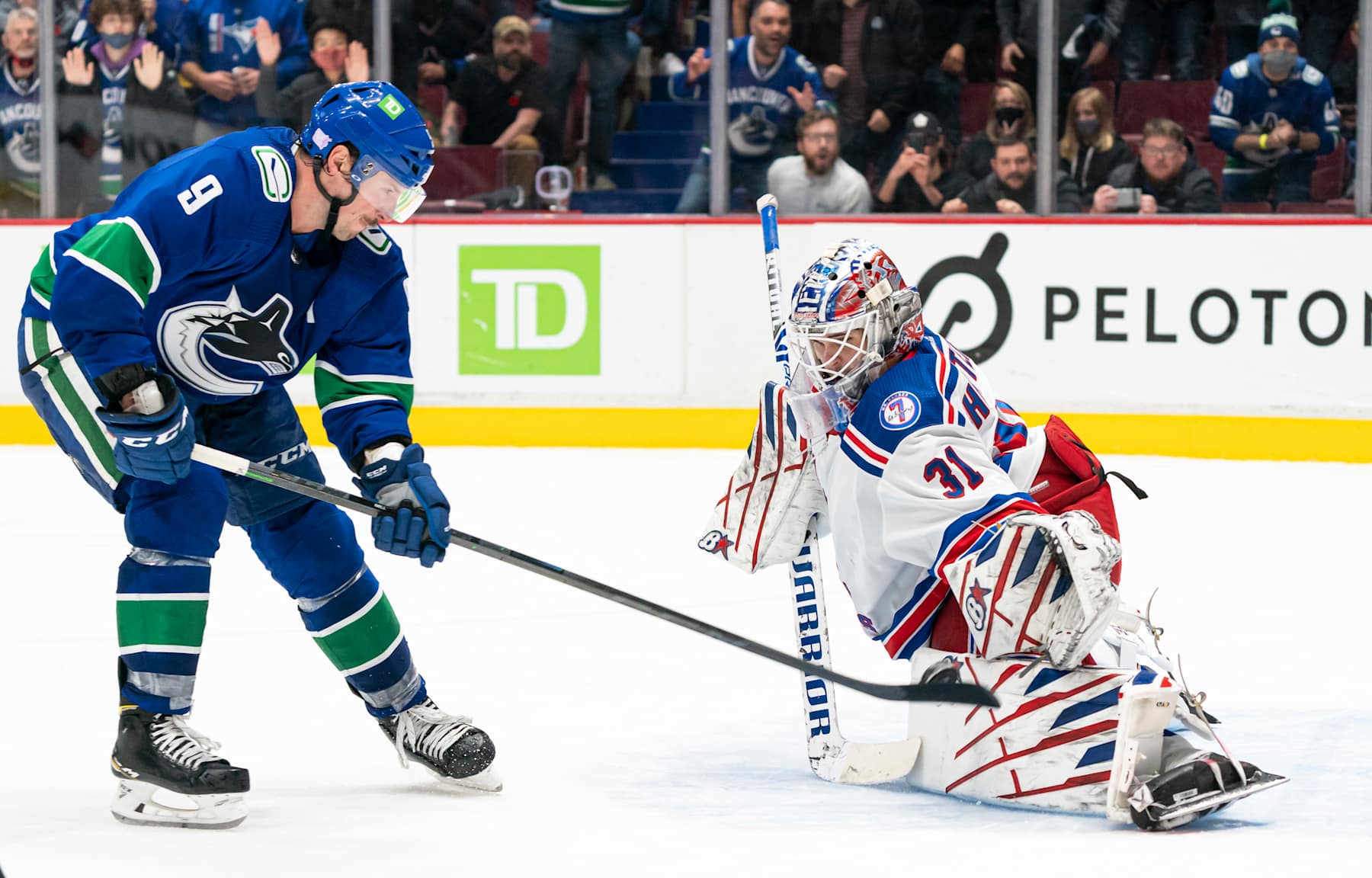 VANCOUVER, BC - NOVEMBER 2: Goalie Igor Shesterkin #31 of the New York Rangers stops J.T. Miller #9 of the Vancouver Canucks during the overtime period on November, 2, 2021 at Rogers Arena in Vancouver, British Columbia, Canada.  (Photo by Rich Lam/Getty Images)