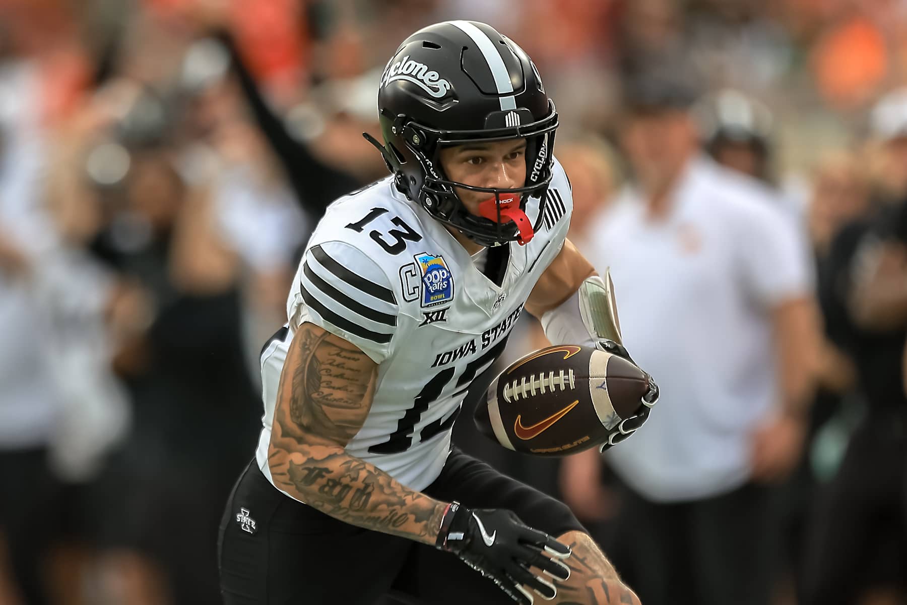 ORLANDO, FLORIDA - DECEMBER 28:Jaylin Noel #13 of the Iowa State Cyclones runs the ball during the first half of the 2024 Pop-Tarts Bowl between Miami Hurricanes and Iowa State Cyclones at Camping World Stadium on December 28, 2024 in Orlando, Florida. (Photo by Dustin Markland/Getty Images)