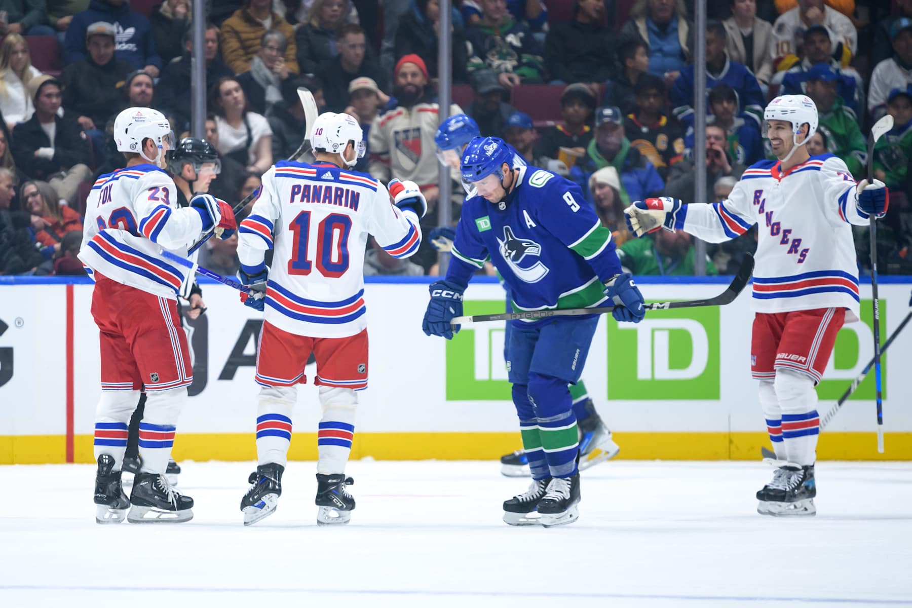 VANCOUVER, CANADA - OCTOBER 28: Artemi Panarin #10 of the New York Rangers is congratulated after scoring a goal as J.T. Miller #9 of the Vancouver Canucks skates on during the first period of their NHL game at Rogers Arena on October 28, 2023 in Vancouver, British Columbia, Canada. (Photo by Derek Cain/Getty Images)