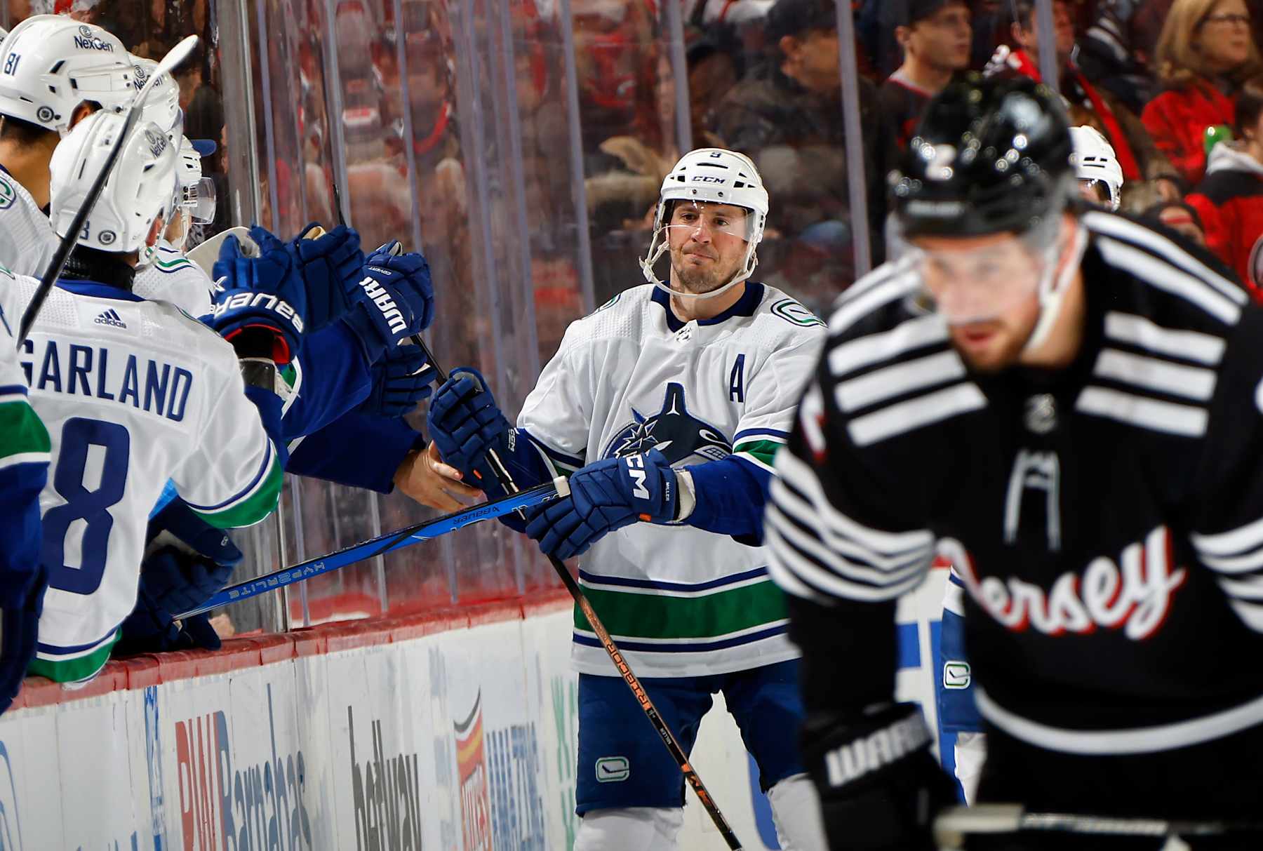 NEWARK, NEW JERSEY - JANUARY 06: J.T. Miller #9 of the Vancouver Canucks celebrates his goal against the New Jersey Devils at 4:37 of the second period at Prudential Center on January 06, 2024 in Newark, New Jersey. (Photo by Bruce Bennett/Getty Images)