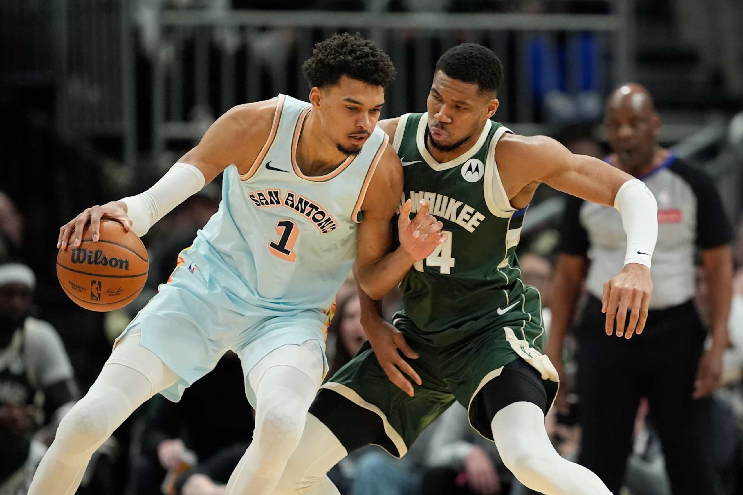 MILWAUKEE, WISCONSIN - JANUARY 08: Giannis Antetokounmpo #34 of the Milwaukee Bucks defends Victor Wembanyama #1 of the San Antonio Spurs during the second quarter at Fiserv Forum on January 08, 2025 in Milwaukee, Wisconsin. NOTE TO USER: User expressly acknowledges and agrees that, by downloading and or using this photograph, User is consenting to the terms and conditions of the Getty Images License Agreement. (Photo by Patrick McDermott/Getty Images)