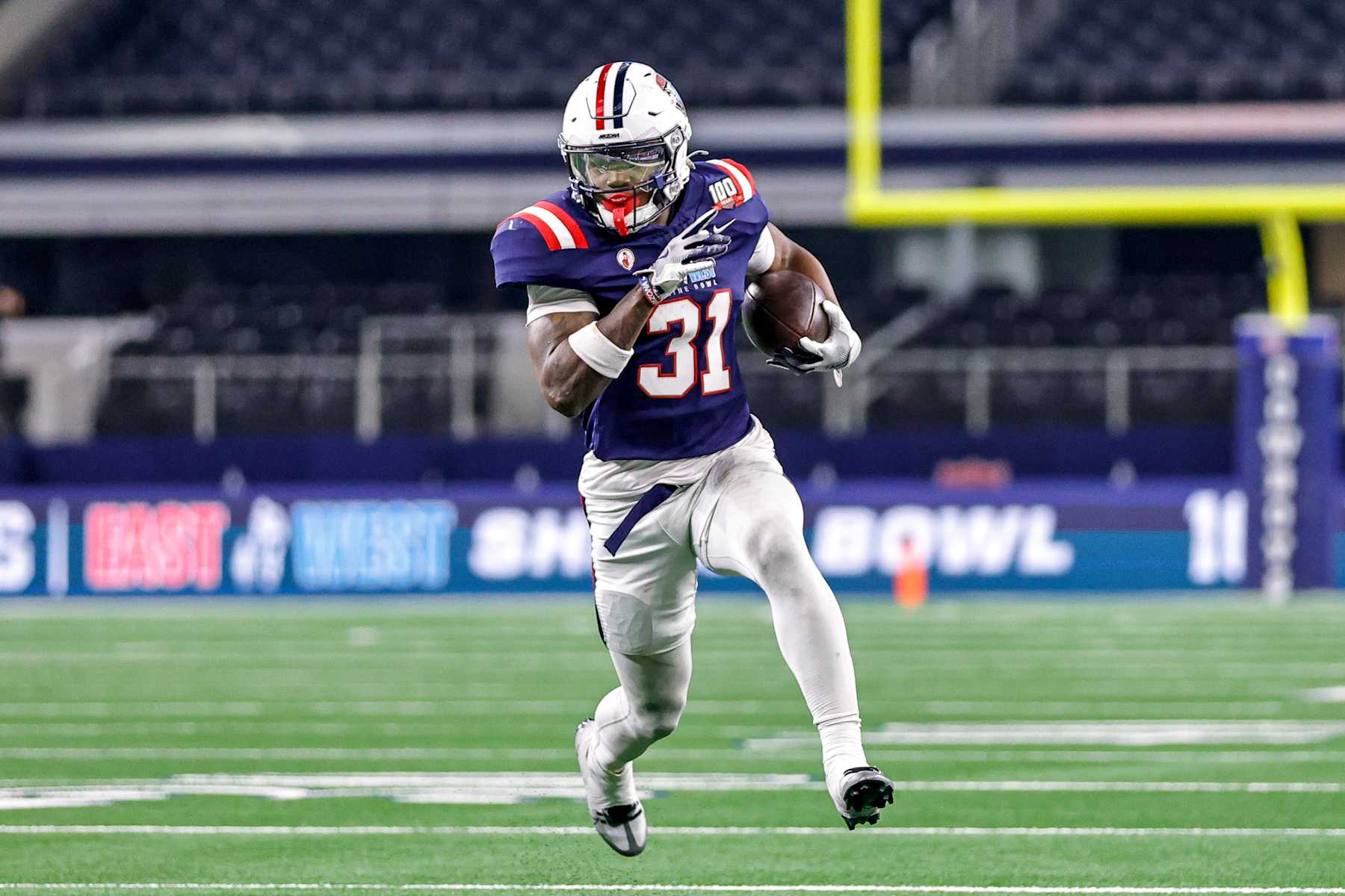 ARLINGTON, TX - JANUARY 30: East's Jacory Croskey-Merritt (31) of Arizona runs for a first down during the East West Shrine Bowl game between the East and the West teams on January 30, 2025 at AT&T Stadium in Arlington, Texas. (Photo by Matthew Pearce/Icon Sportswire via Getty Images)