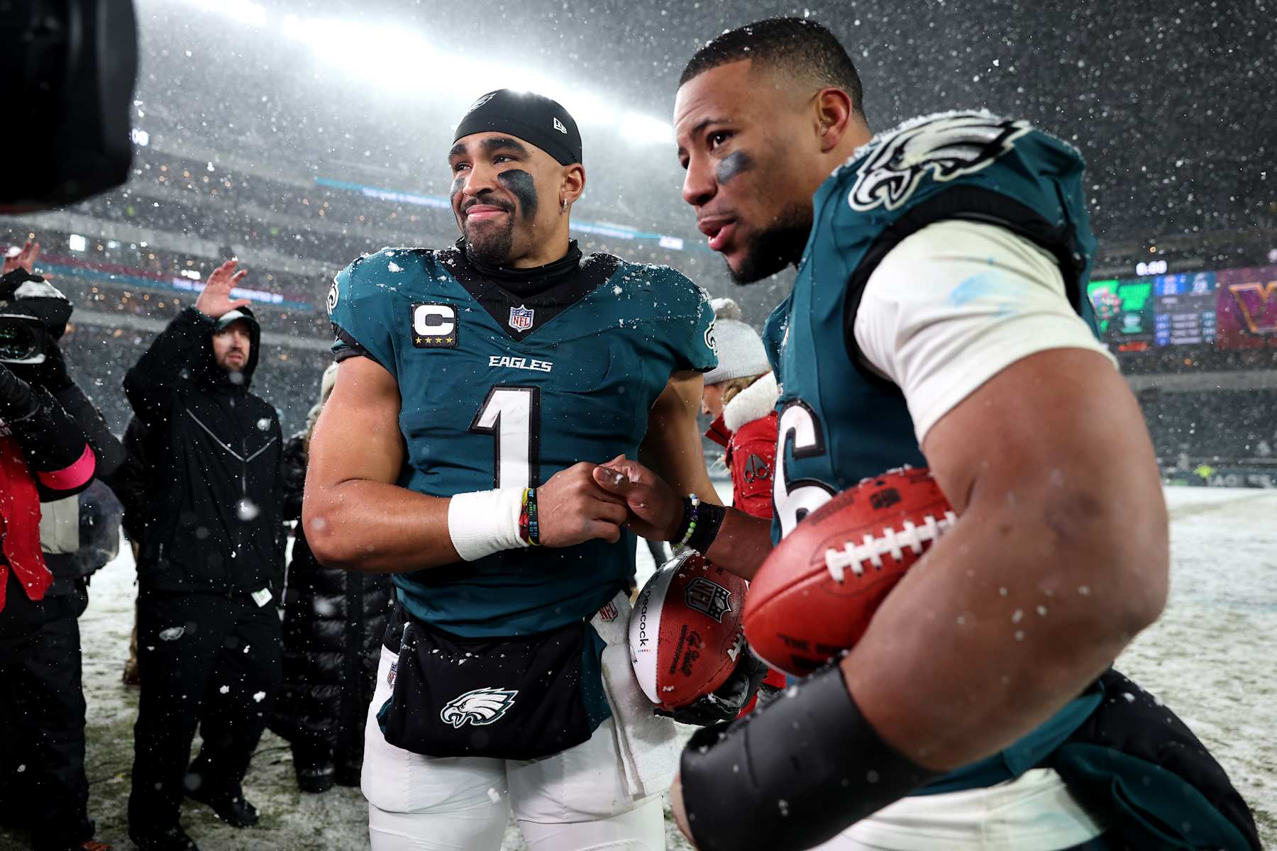 PHILADELPHIA, PENNSYLVANIA - JANUARY 19: (L-R) Jalen Hurts #1 and Saquon Barkley #26 of the Philadelphia Eagles react after defeating the Los Angeles Rams 28-22  in the NFC Divisional Playoff at Lincoln Financial Field on January 19, 2025 in Philadelphia, Pennsylvania. (Photo by Sarah Stier/Getty Images)
