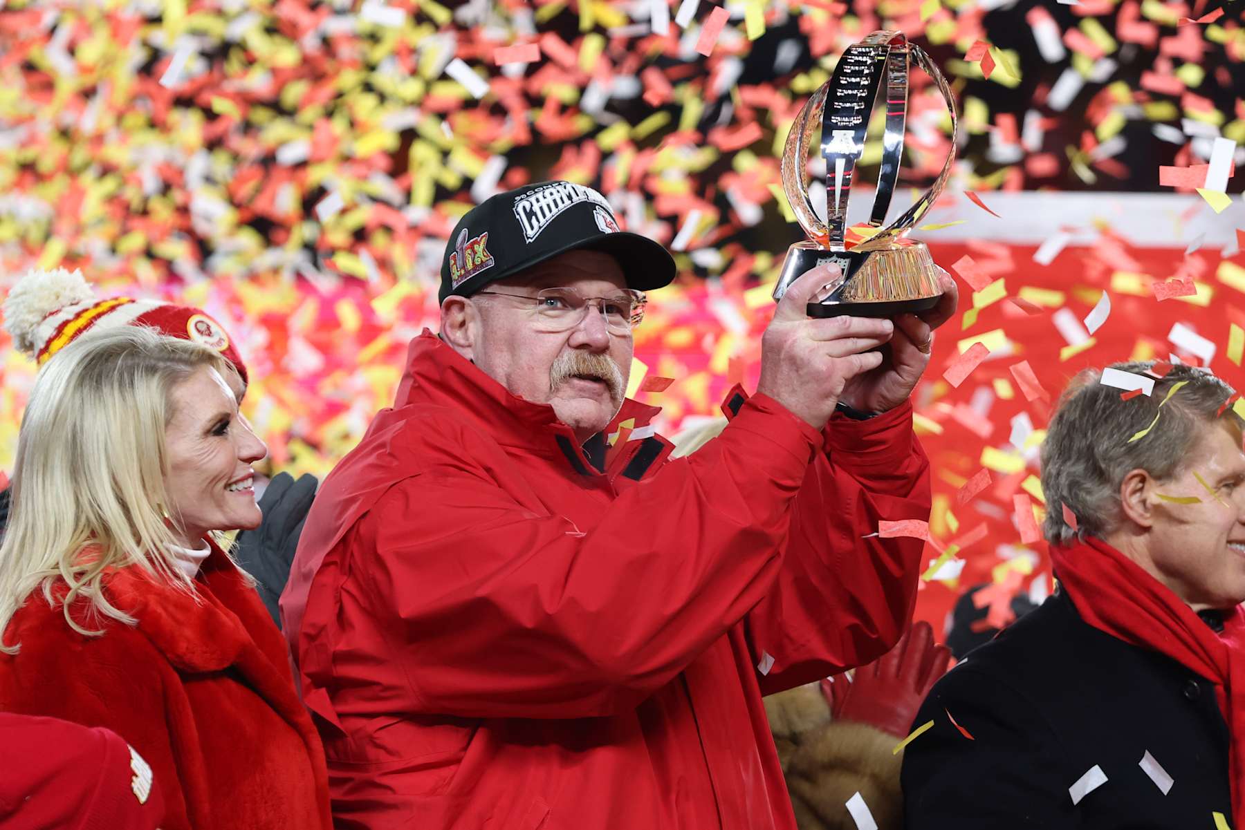 KANSAS CITY, MO - JANUARY 26: Kansas City Chiefs head coach Andy Reid holds up the Lamar Hunt AFC Championship trophy as confetti fills the air after defeating the Buffalo Bills on January 26, 2025 at GEHA Field at Arrowhead Stadium in Kansas City, MO. (Photo by Scott Winters/Icon Sportswire via Getty Images)