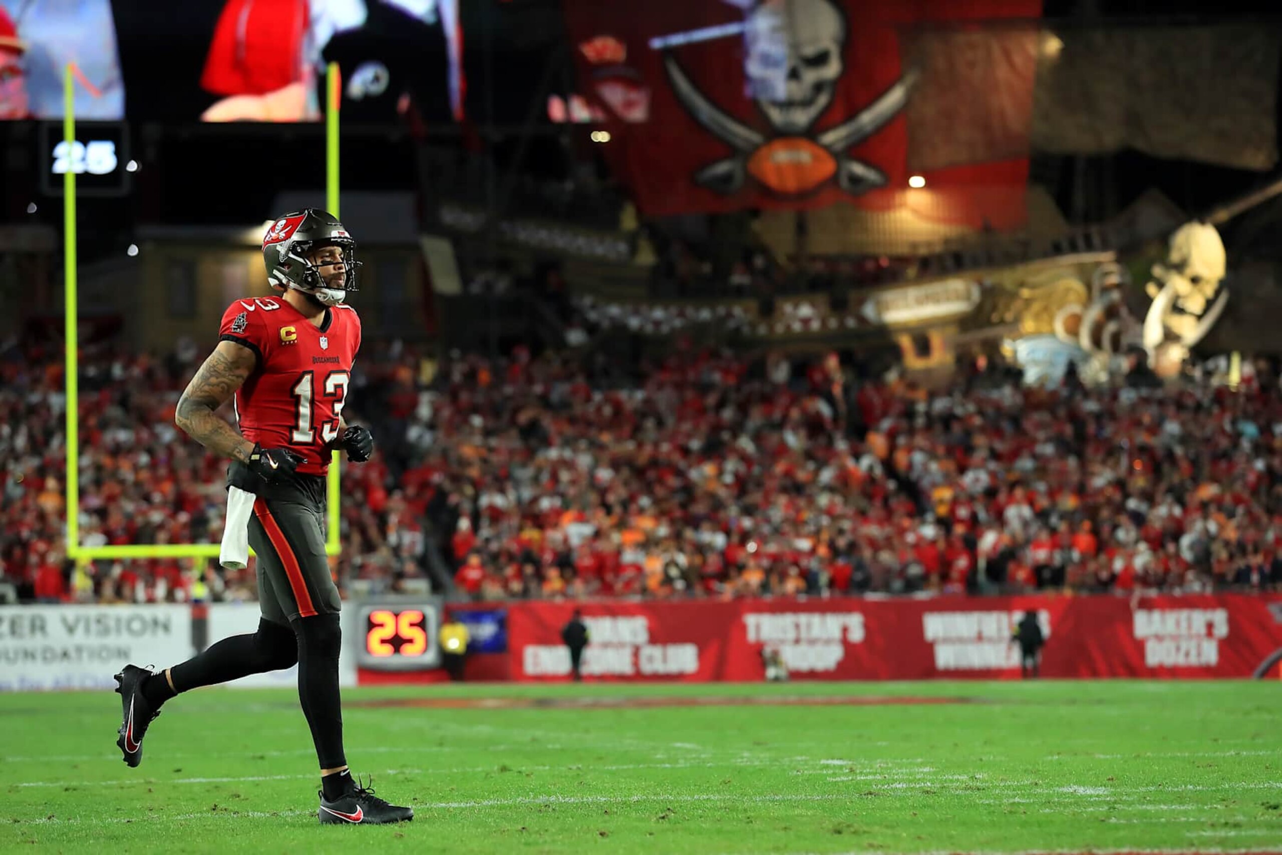 TAMPA, FL - JANUARY 12: Tampa Bay Buccaneers Wide Receiver Mike Evans (13) trots onto the field during the NFC Wild Card Playoff game between the Washington Commanders and the Tampa Bay Buccaneers on January 12, 2025 at Raymond James Stadium in Tampa, Florida. (Photo by Cliff Welch/Icon Sportswire via Getty Images) TAMPA, FL - JANUARY 12: Tampa Bay Buccaneers Wide Receiver Mike Evans (13) trots onto the field during the NFC Wild Card Playoff game between the Washington Commanders and the Tampa Bay Buccaneers on January 12, 2025 at Raymond James Stadium in Tampa, Florida. (Photo by Cliff Welch/Icon Sportswire via Getty Images)