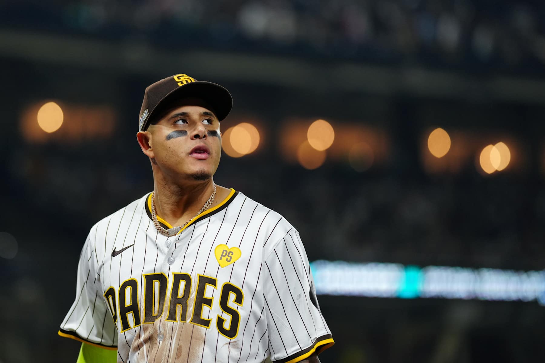 SAN DIEGO, CA - OCTOBER 08: Manny Machado #13 of the San Diego Padres leaves the field during Game 3 of the Division Series presented by Booking.com between the Los Angeles Dodgers and the San Diego Padres at Petco Park on Tuesday, October 8, 2024 in San Diego, California. (Photo by Daniel Shirey/MLB Photos via Getty Images)