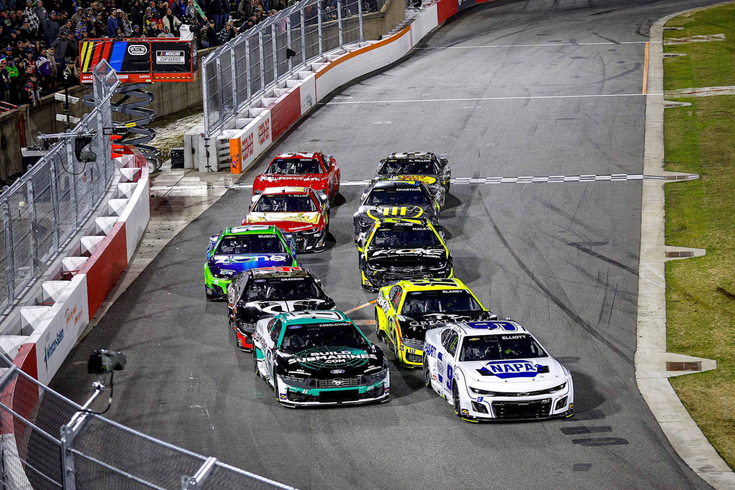 WINSTON SALEM, NORTH CAROLINA - FEBRUARY 01: Chase Elliott, driver of the #9 NAPA Auto Parts Chevrolet, Brad Keselowski, driver of the #6 BuildSubmarines.com Ford Ryan Blaney, driver of the #12 Menards/Great Lakes Flooring Ford and Noah Gragson, driver of the #4 TrueTimber Ford race during qualifying heat #1 for the Cook Out Clash at Bowman Gray Stadium on February 01, 2025 in Winston Salem, North Carolina. (Photo by Sean Gardner/Getty Images)