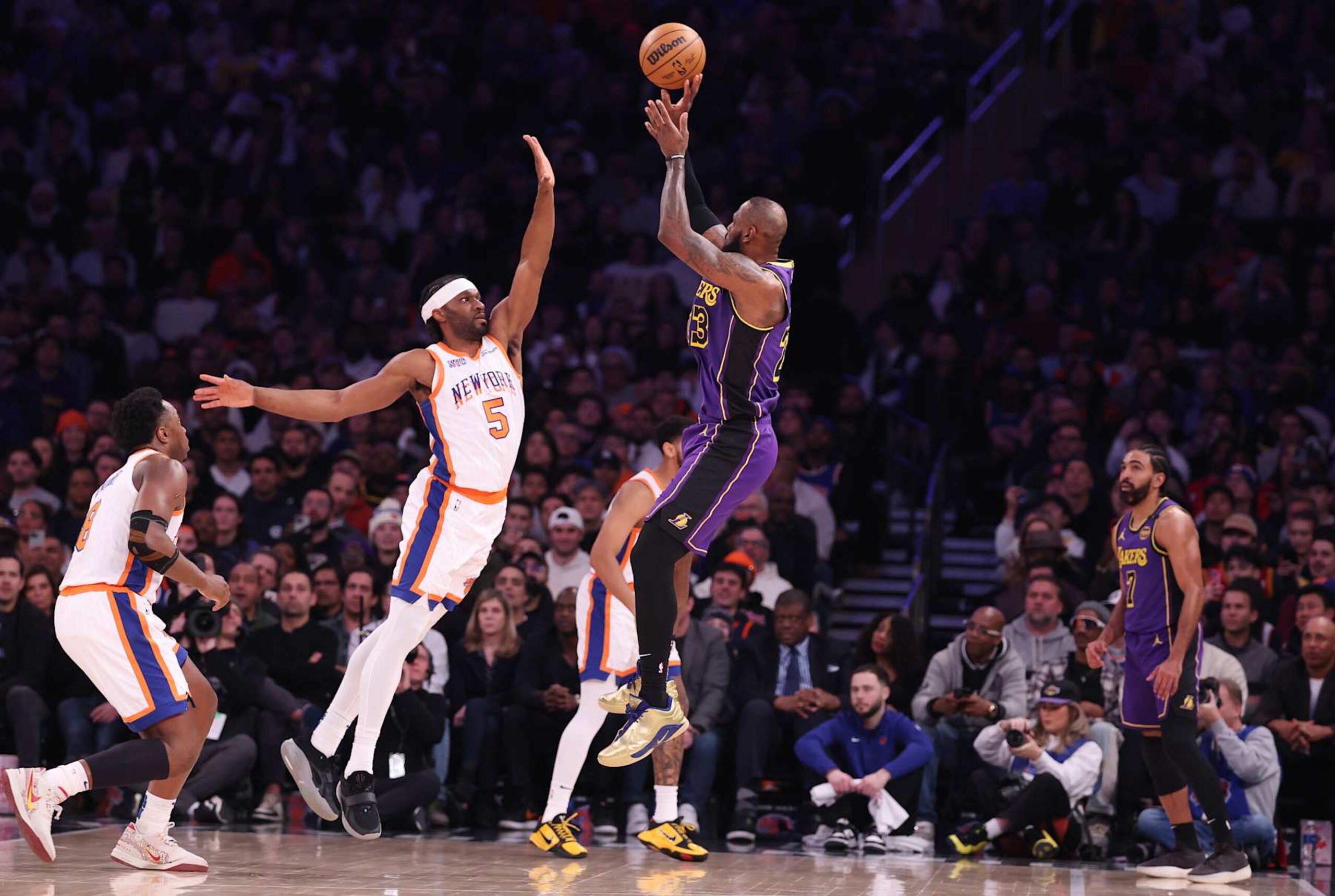 NEW YORK, NEW YORK - FEBRUARY 01: LeBron James #23 of the Los Angeles Lakers shoots against Precious Achiuwa #5 of the New York Knicks during their game at Madison Square Garden on February 01, 2025 in New York City.  User expressly acknowledges and agrees that, by downloading and or using this photograph, User is consenting to the terms and conditions of the Getty Images License Agreement.   (Photo by Al Bello/Getty Images)