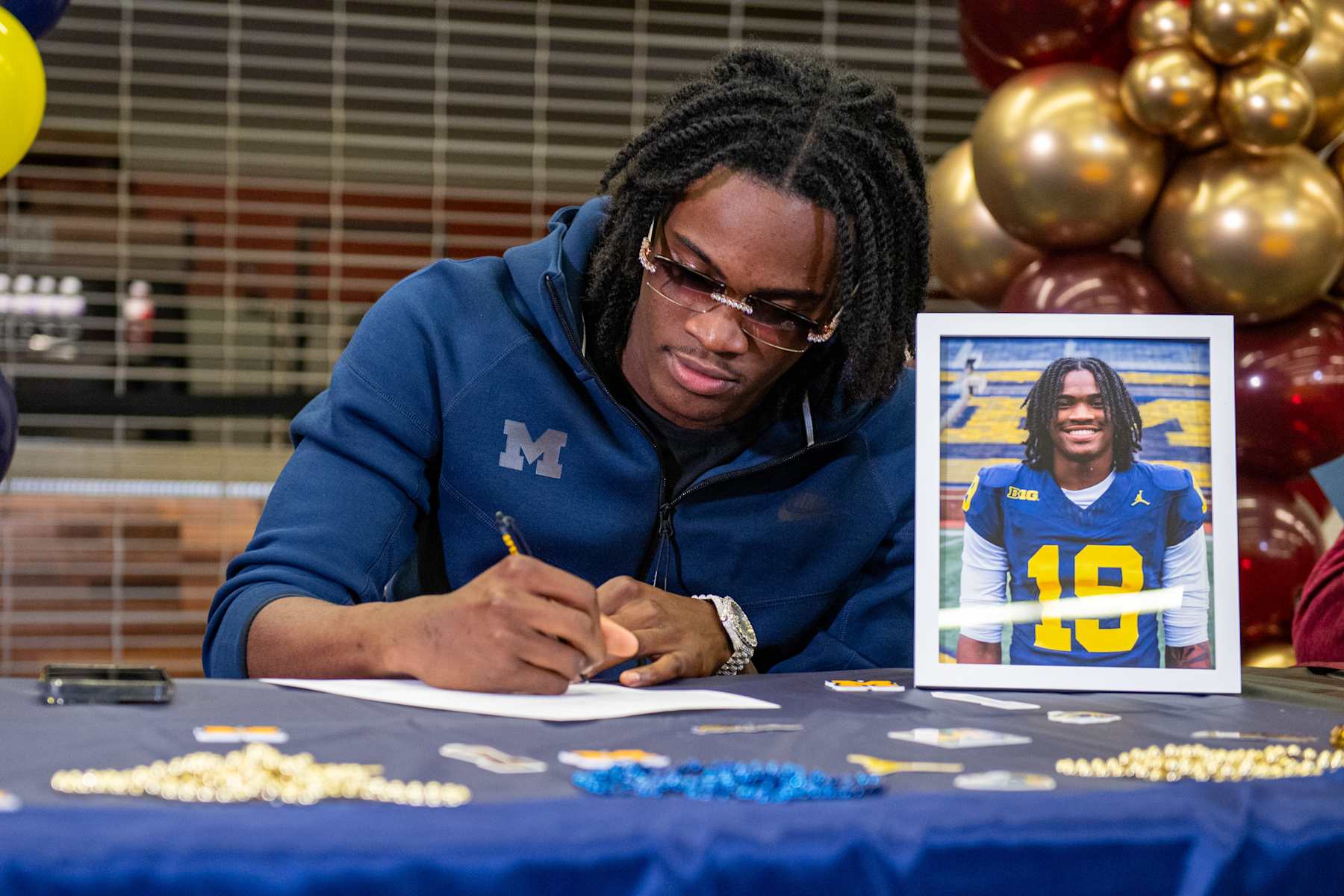 BELLEVILLE, MICHIGAN - DECEMBER 04:  Nationally No. 1 ranked high school recruit, quarterback Bryce Underwood signs his letter of intent to play for the Michigan Wolverines at Belleville High School on December 04, 2024 in Belleville, Michigan. (Photo by Aaron J. Thornton/Getty Images)