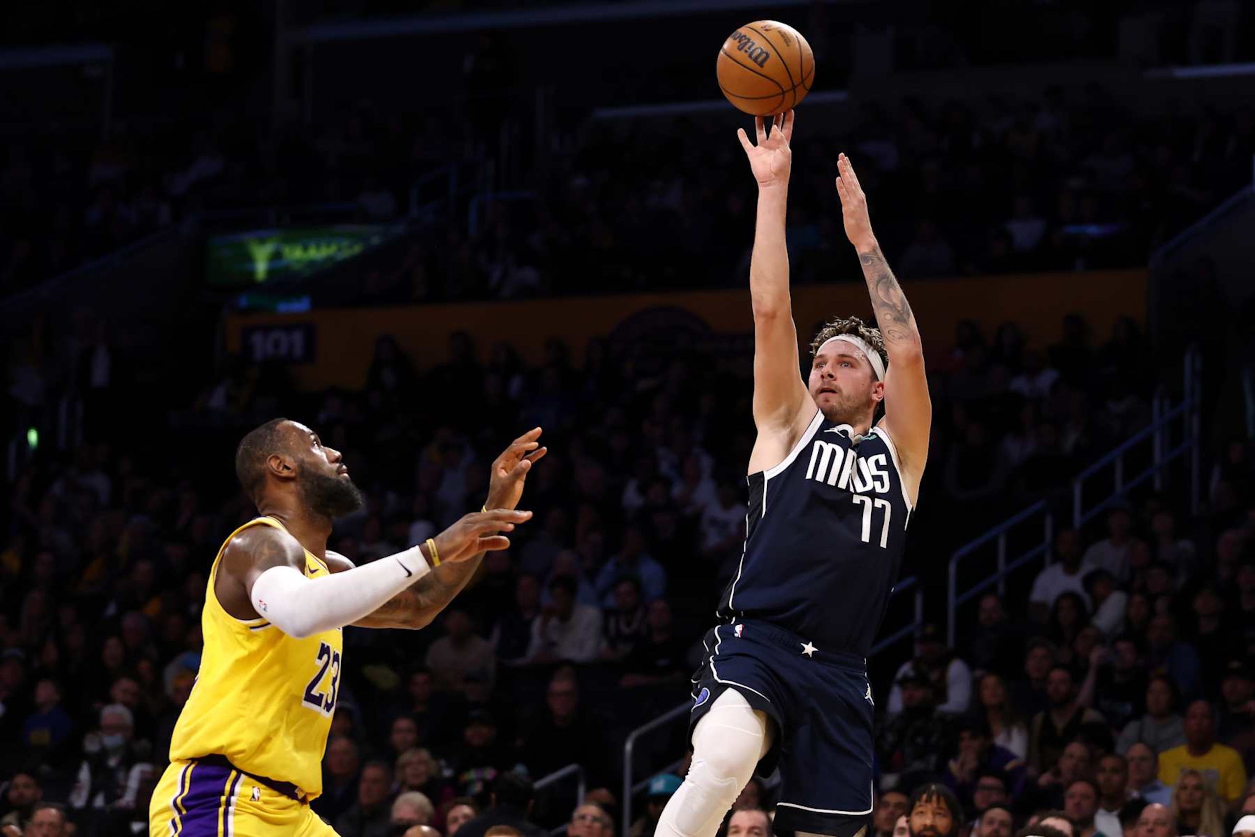 LOS ANGELES, CALIFORNIA - JANUARY 17: Luka Doncic #77 of the Dallas Mavericks shoots the ball against LeBron James #23 of the Los Angeles Lakers during the second quarter at Crypto.com Arena on January 17, 2024 in Los Angeles, California. NOTE TO USER: User expressly acknowledges and agrees that, by downloading and or using this photograph, User is consenting to the terms and conditions of the Getty Images License Agreement. (Photo by Katelyn Mulcahy/Getty Images)
