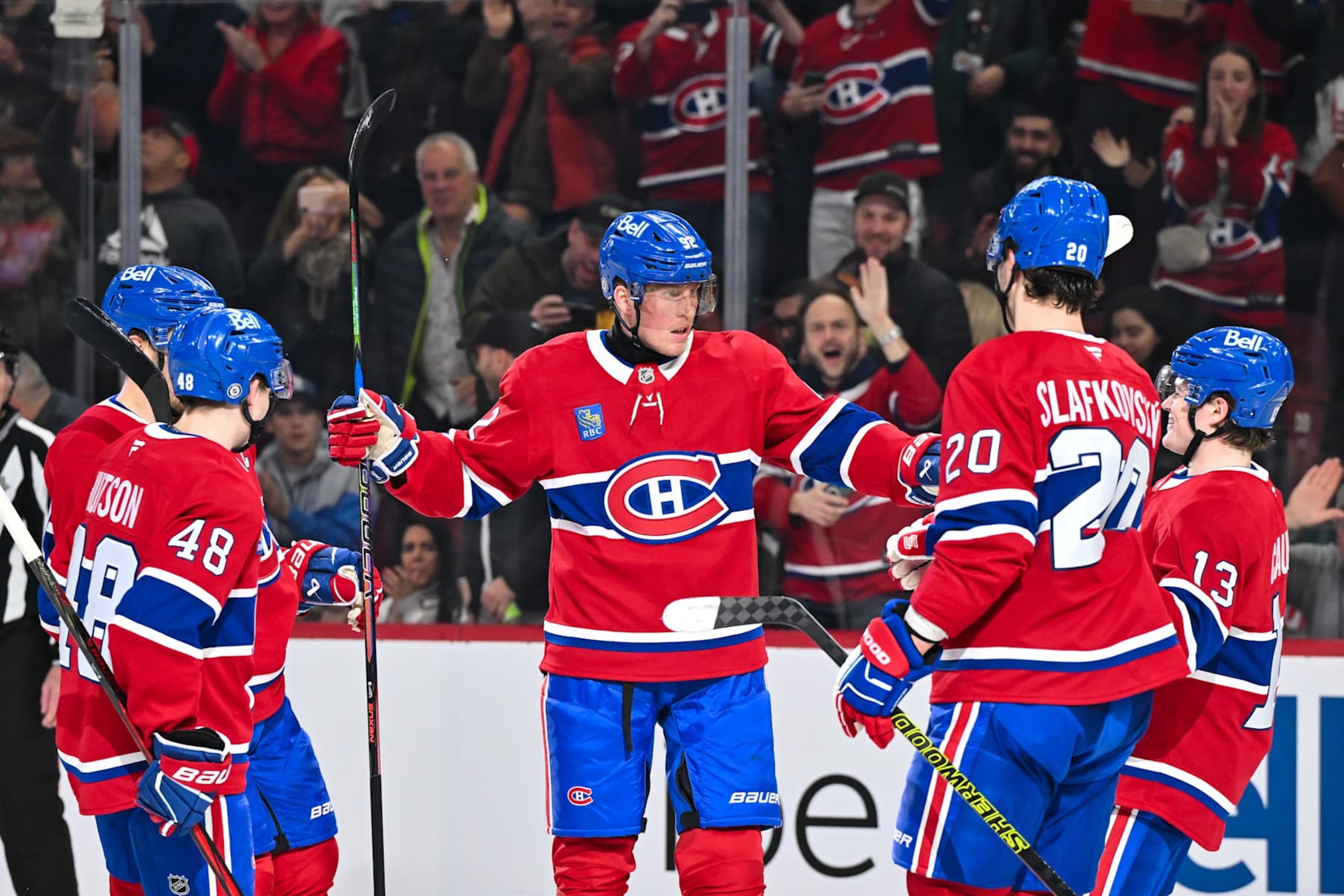 MONTREAL, CANADA - DECEMBER 17:  Patrik Laine #92 of the Montreal Canadiens celebrates his 2nd goal of the game with teammates Lane Hutson #48, Juraj Slafkovsky #20 and Cole Caufield #13 during the second period against the Buffalo Sabres at the Bell Centre on December 17, 2024 in Montreal, Quebec, Canada.  (Photo by Minas Panagiotakis/Getty Images)
