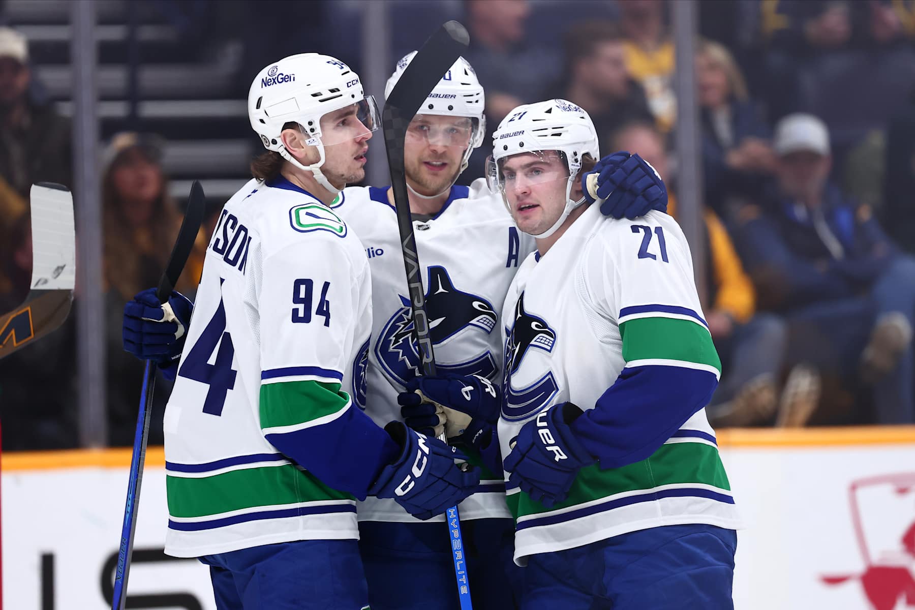 NASHVILLE, TENNESSEE - JANUARY 29:  Elias Pettersson #40, Nils Hoglander #21, and Linus Karlsson #94 of the Vancouver Canucks celebrate a goal in the first period against the Nashville Predators on January 29, 2025 at Bridgestone Arena in Nashville. (Photo by Casey Gower/NHLI via Getty Images)