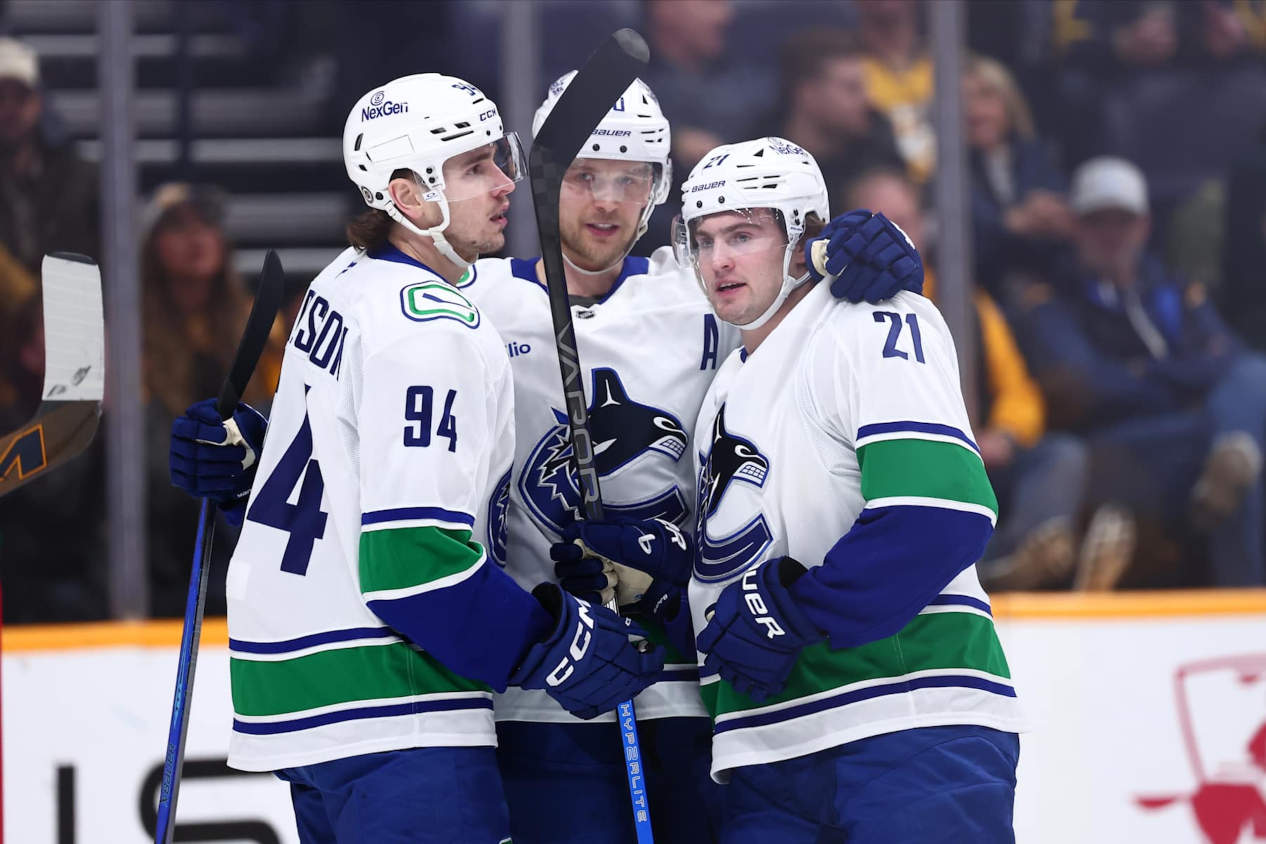 NASHVILLE, TENNESSEE - JANUARY 29:  Elias Pettersson #40, Nils Hoglander #21, and Linus Karlsson #94 of the Vancouver Canucks celebrate a goal in the first period against the Nashville Predators on January 29, 2025 at Bridgestone Arena in Nashville. (Photo by Casey Gower/NHLI via Getty Images)
