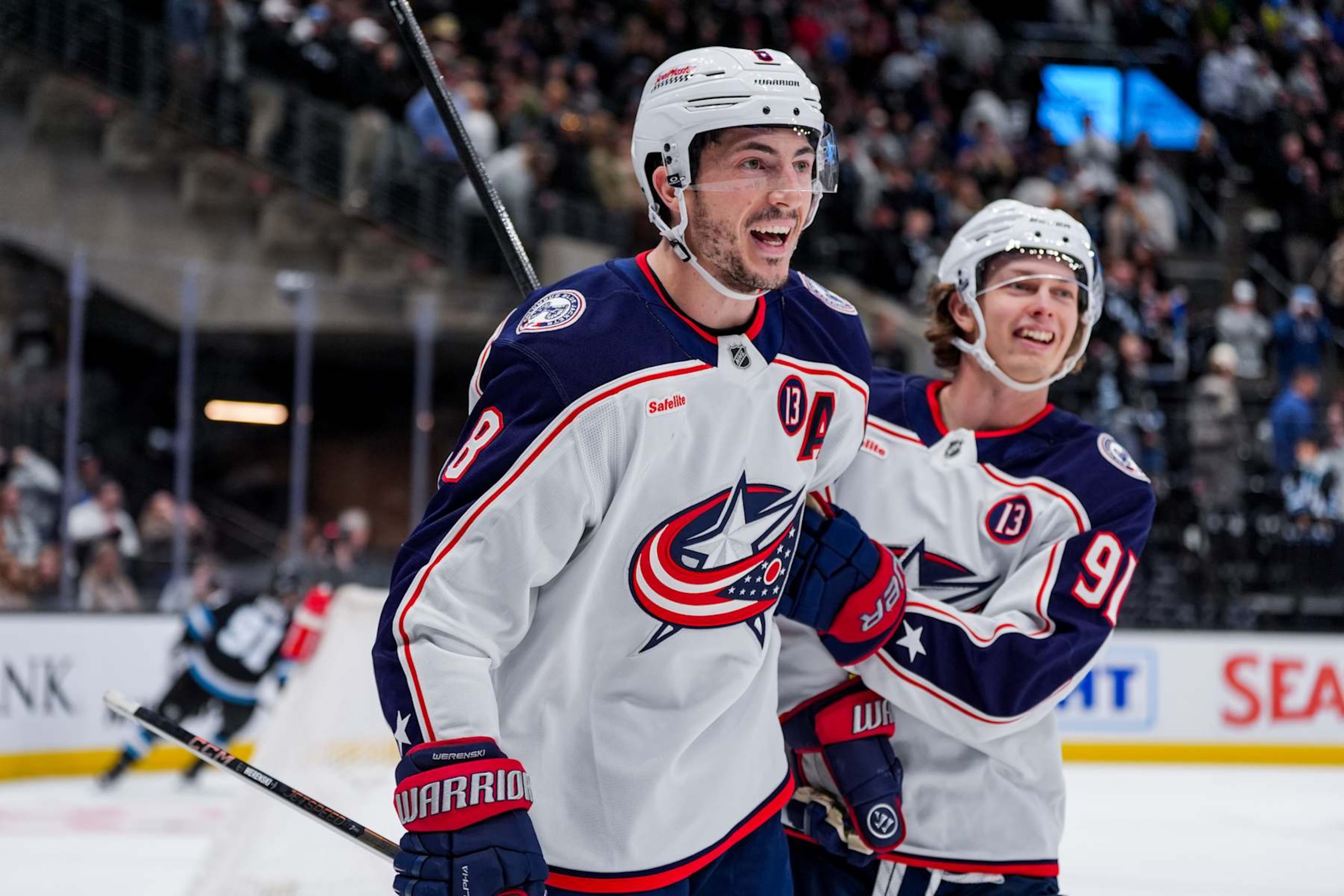 SALT LAKE CITY, UTAH - JANUARY 31: Zach Werenski #8 of the Columbus Blue Jackets and Kent Johnson #91 of the Columbus Blue Jackets celebrate a goal during overtime against the Utah Hockey Club on January 31, 2025 at Delta Center in Salt Lake City, Utah.  (Photo by Hunter Dyke/NHLI via Getty Images)