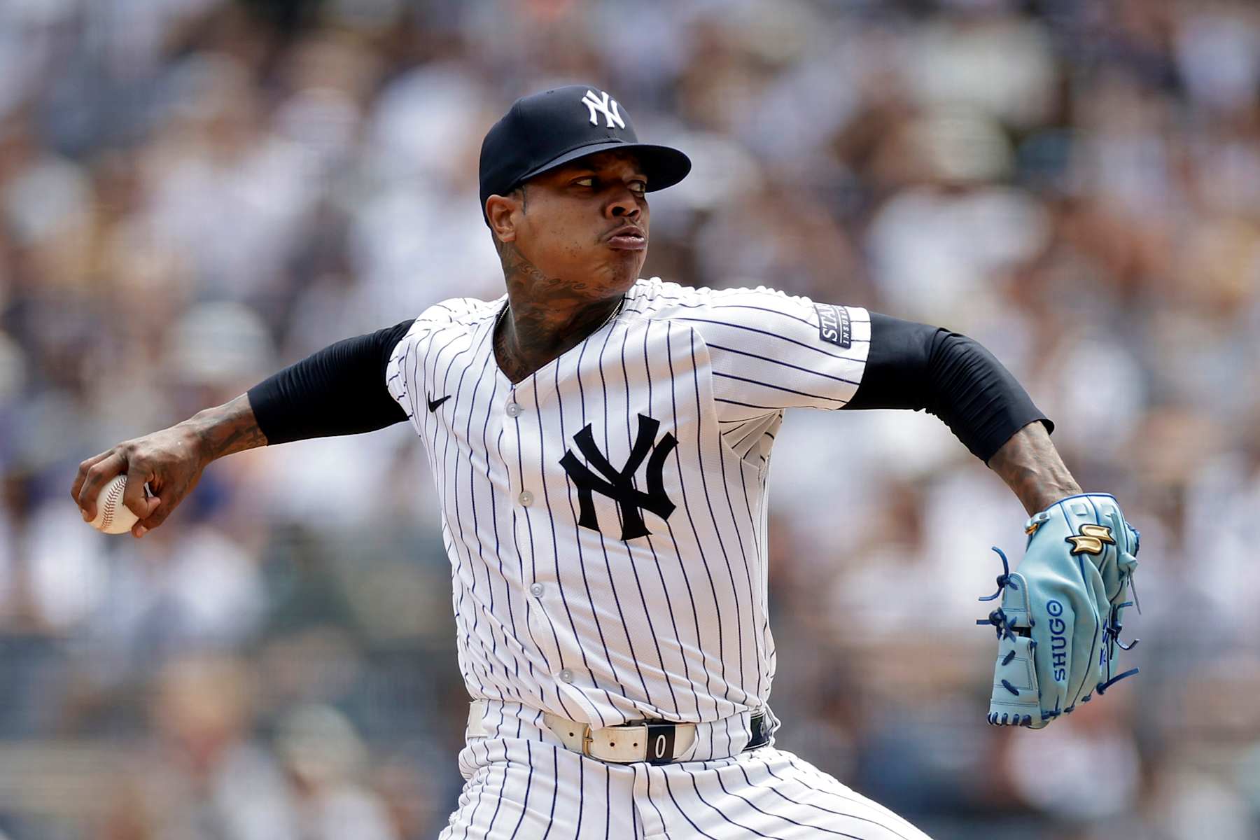 NEW YORK, NY - AUGUST 11: Marcus Stroman #0 of the New York Yankees pitches during the first inning against the Texas Rangers at Yankee Stadium on August 11, 2024 in New York City. (Photo by Adam Hunger/Getty Images)
