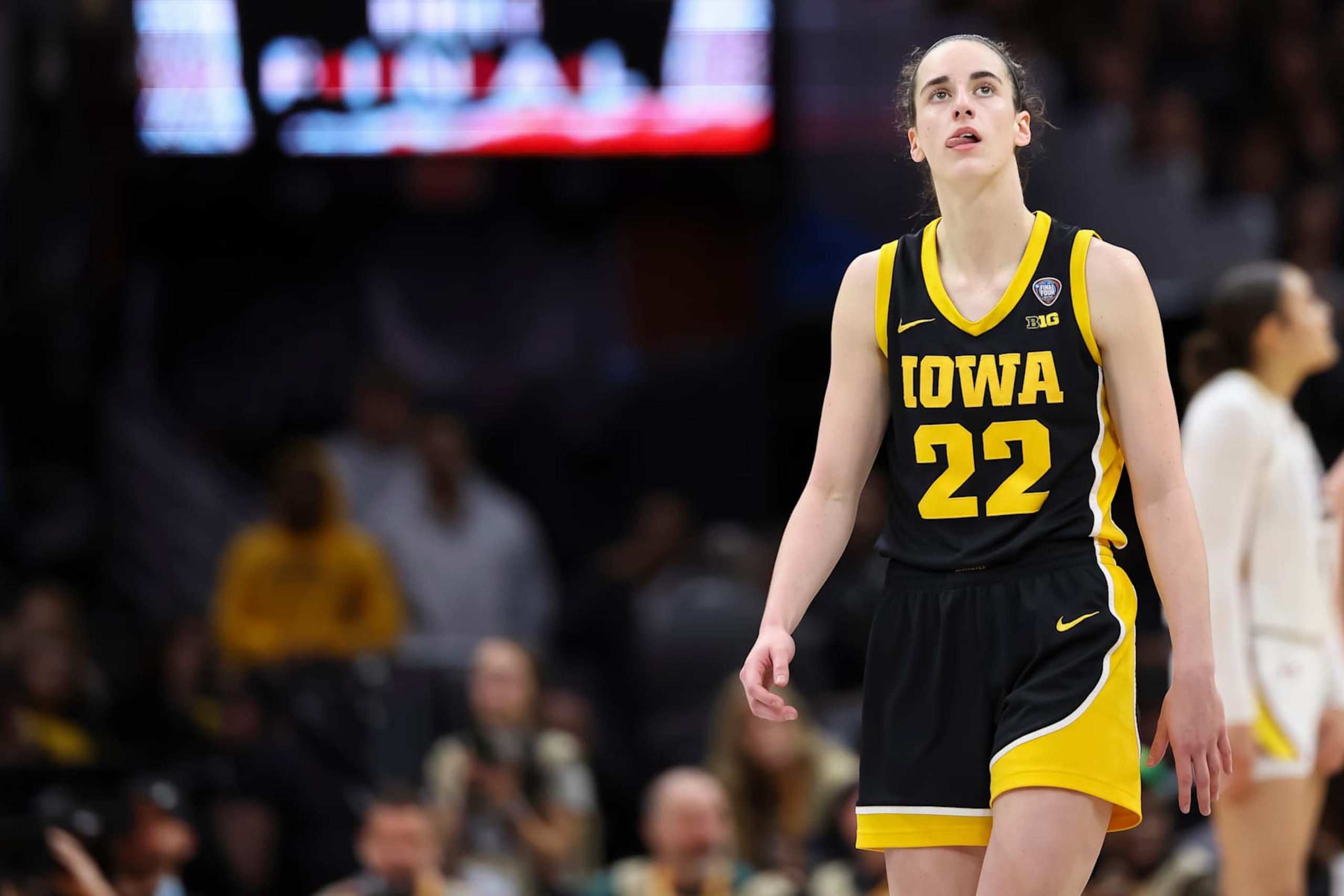 CLEVELAND, OHIO - APRIL 07: Caitlin Clark #22 of the Iowa Hawkeyes looks on against the South Carolina Gamecocks during the NCAA Women's Basketball Tournament National Championship at Rocket Mortgage Fieldhouse on April 7, 2024 in Cleveland, Ohio. (Photo by Justin Tafoya/NCAA Photos via Getty Images) CLEVELAND, OHIO - APRIL 07: Caitlin Clark #22 of the Iowa Hawkeyes looks on against the South Carolina Gamecocks during the NCAA Women's Basketball Tournament National Championship at Rocket Mortgage Fieldhouse on April 7, 2024 in Cleveland, Ohio. (Photo by Justin Tafoya/NCAA Photos via Getty Images)