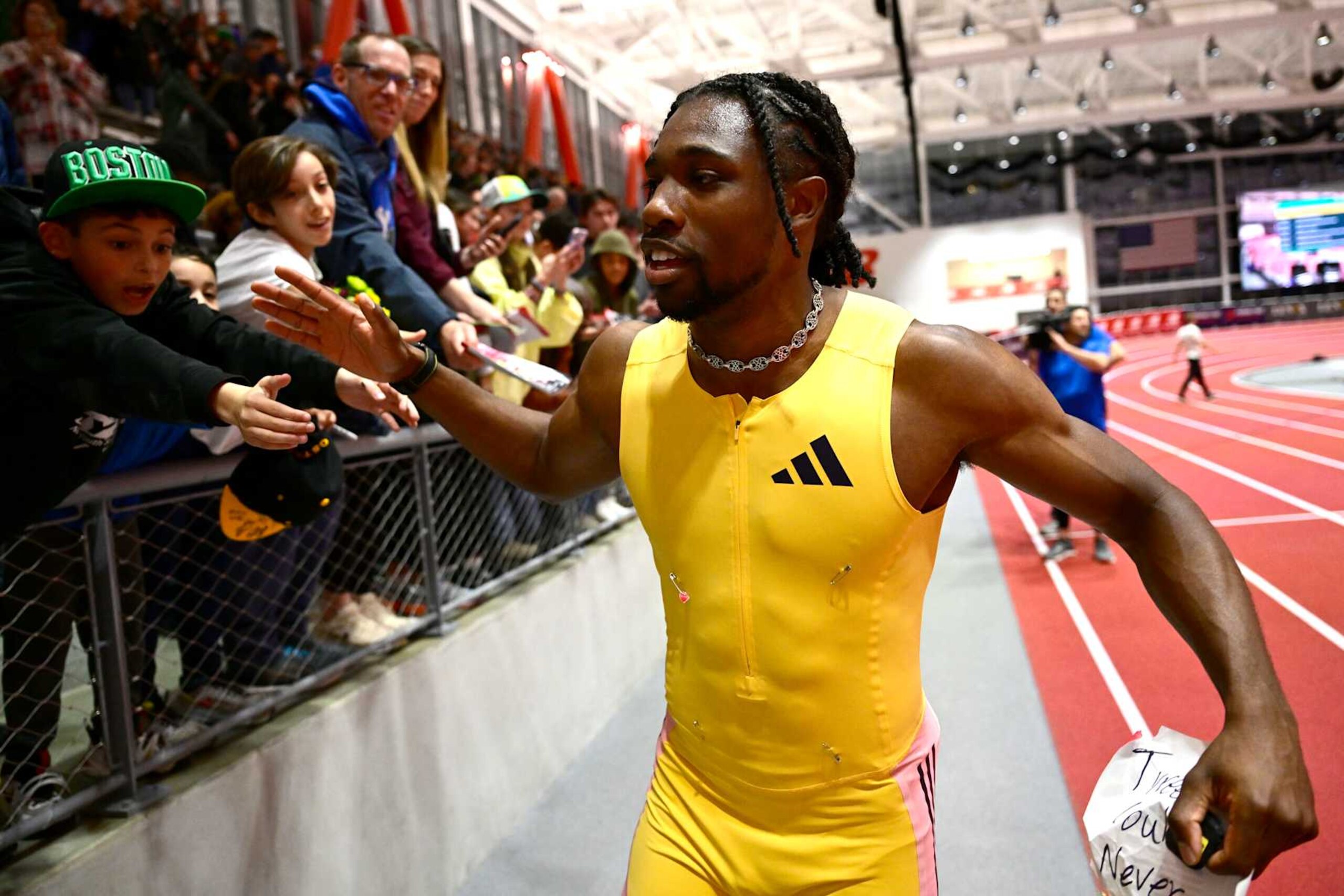BOSTON, MASSACHUSETTS - FEBRUARY 02: Noah Lyles of the United States reacts with fans after winning the men's 60m final during the New Balance Indoor Grand Prix on February 02, 2025 in Boston, Massachusetts.  (Photo by Billie Weiss/Getty Images)