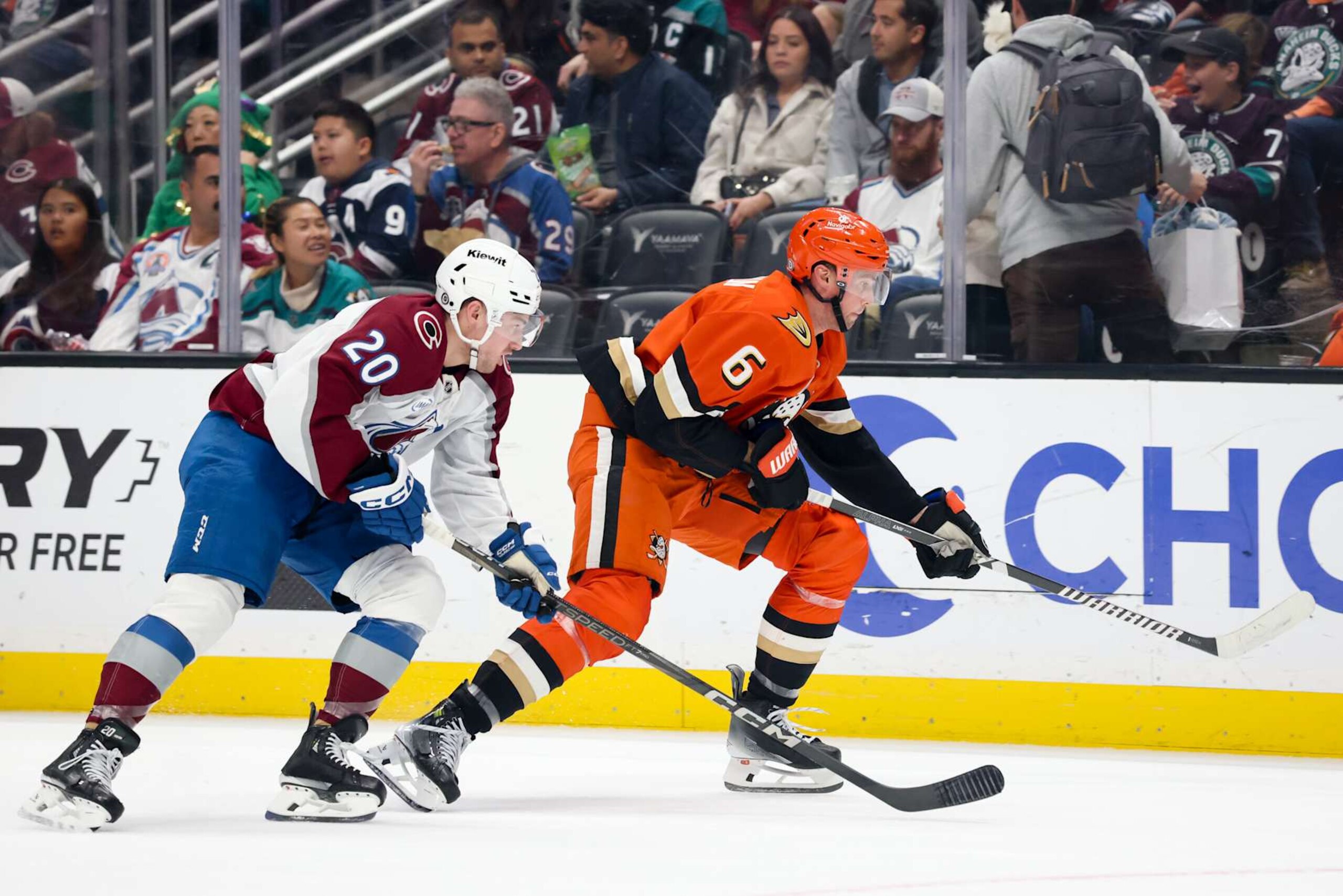 ANAHEIM, CA - DECEMBER 20:  Ross Colton #20 of the Colorado Avalanche and Brian Dumoulin #6 of the Anaheim Ducks battle for position during the second period at Honda Center on December 20, 2024 in Anaheim, California. (Photo by Debora Robinson/NHLI via Getty Images)
