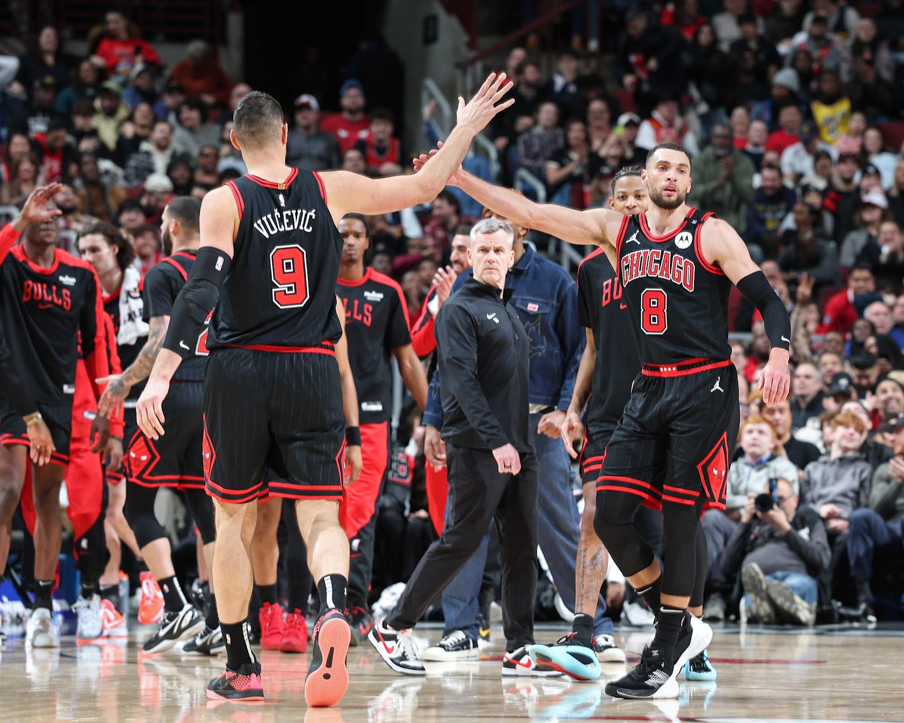 CHICAGO, IL - JANUARY 27: Zach LaVine #8 and Nikola Vucevic #9 of the Chicago Bulls high five during the game against the Denver Nuggets on January 27, 2025 at United Center in Chicago, Illinois. NOTE TO USER: User expressly acknowledges and agrees that, by downloading and or using this photograph, User is consenting to the terms and conditions of the Getty Images License Agreement. Mandatory Copyright Notice: Copyright 2025 NBAE (Photo by Jeff Haynes/NBAE via Getty Images)