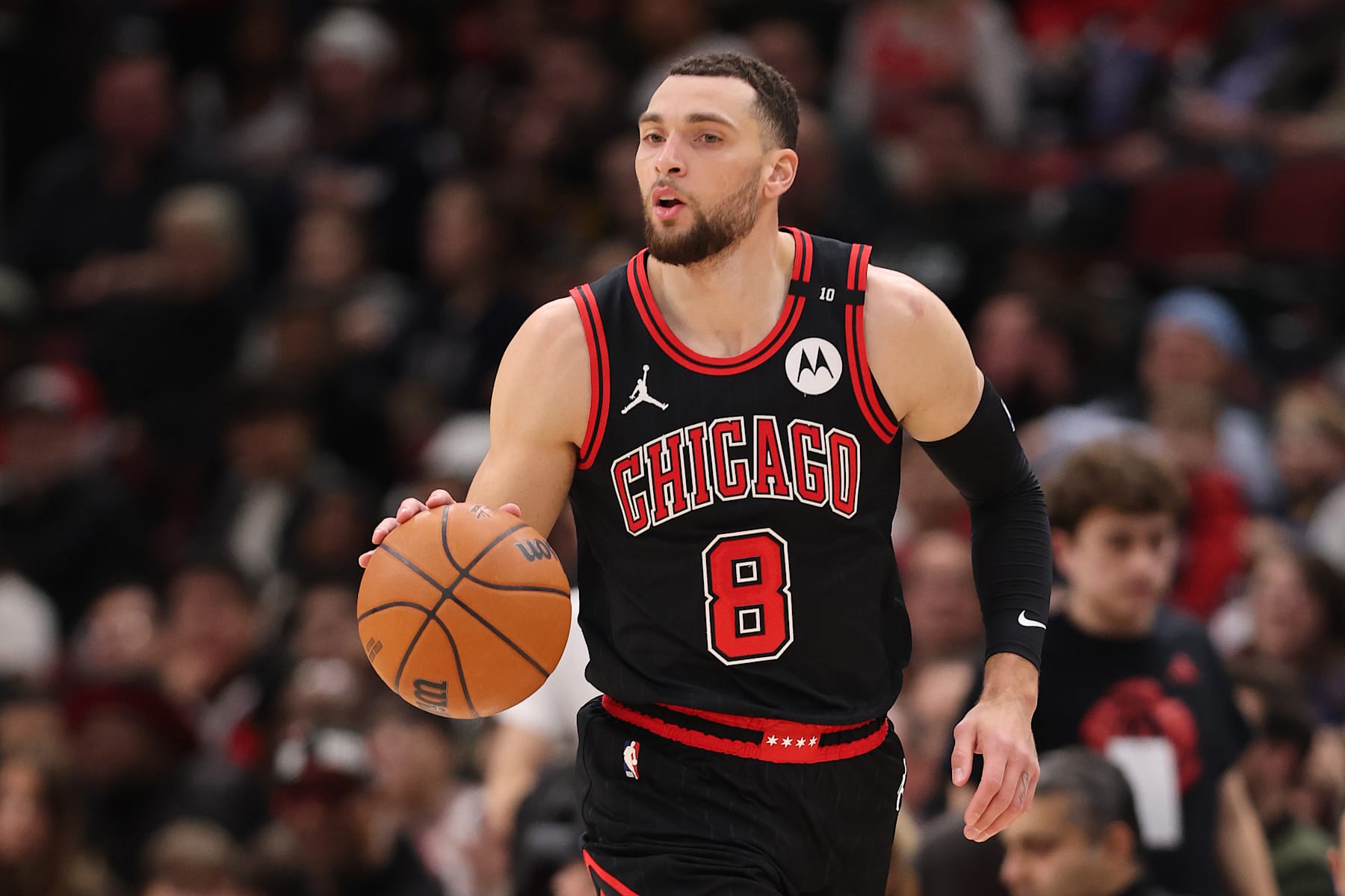 CHICAGO, ILLINOIS - JANUARY 27: Zach LaVine #8 of the Chicago Bulls dribbles up the court against the Denver Nuggets during the second half at the United Center on January 27, 2025 in Chicago, Illinois. NOTE TO USER: User expressly acknowledges and agrees that, by downloading and or using this photograph, User is consenting to the terms and conditions of the Getty Images License Agreement.  (Photo by Michael Reaves/Getty Images)