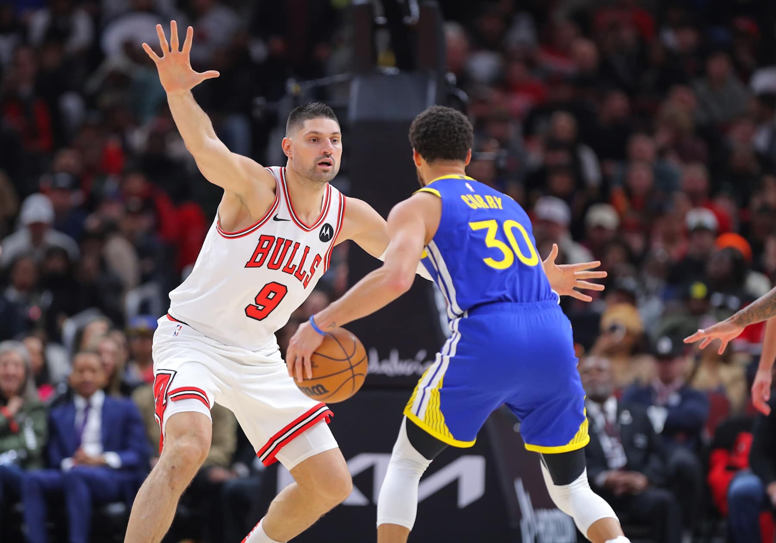 CHICAGO, IL - JANUARY 12: Nikola Vucevic #9 of the Chicago Bulls guards Stephen Curry #30 of the Golden State Warriors during the second half at the United Center on January 12, 2024 in Chicago, Illinois. (Photo by Melissa Tamez/Icon Sportswire via Getty Images) CHICAGO, IL - JANUARY 12: Nikola Vucevic #9 of the Chicago Bulls guards Stephen Curry #30 of the Golden State Warriors during the second half at the United Center on January 12, 2024 in Chicago, Illinois. (Photo by Melissa Tamez/Icon Sportswire via Getty Images)